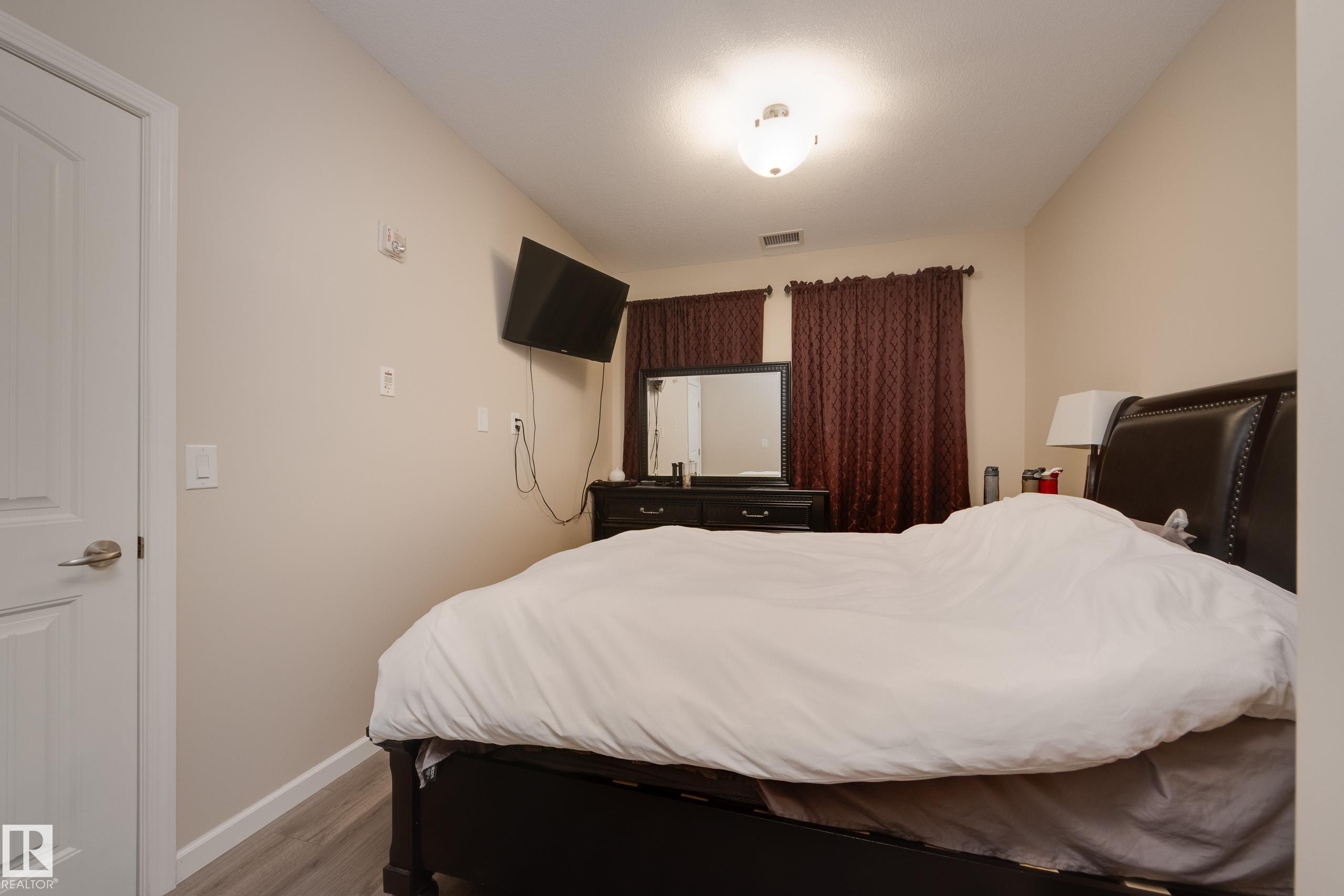 317 6083 Maynard Way, Edmonton, AB - Indoor Photo Showing Bedroom