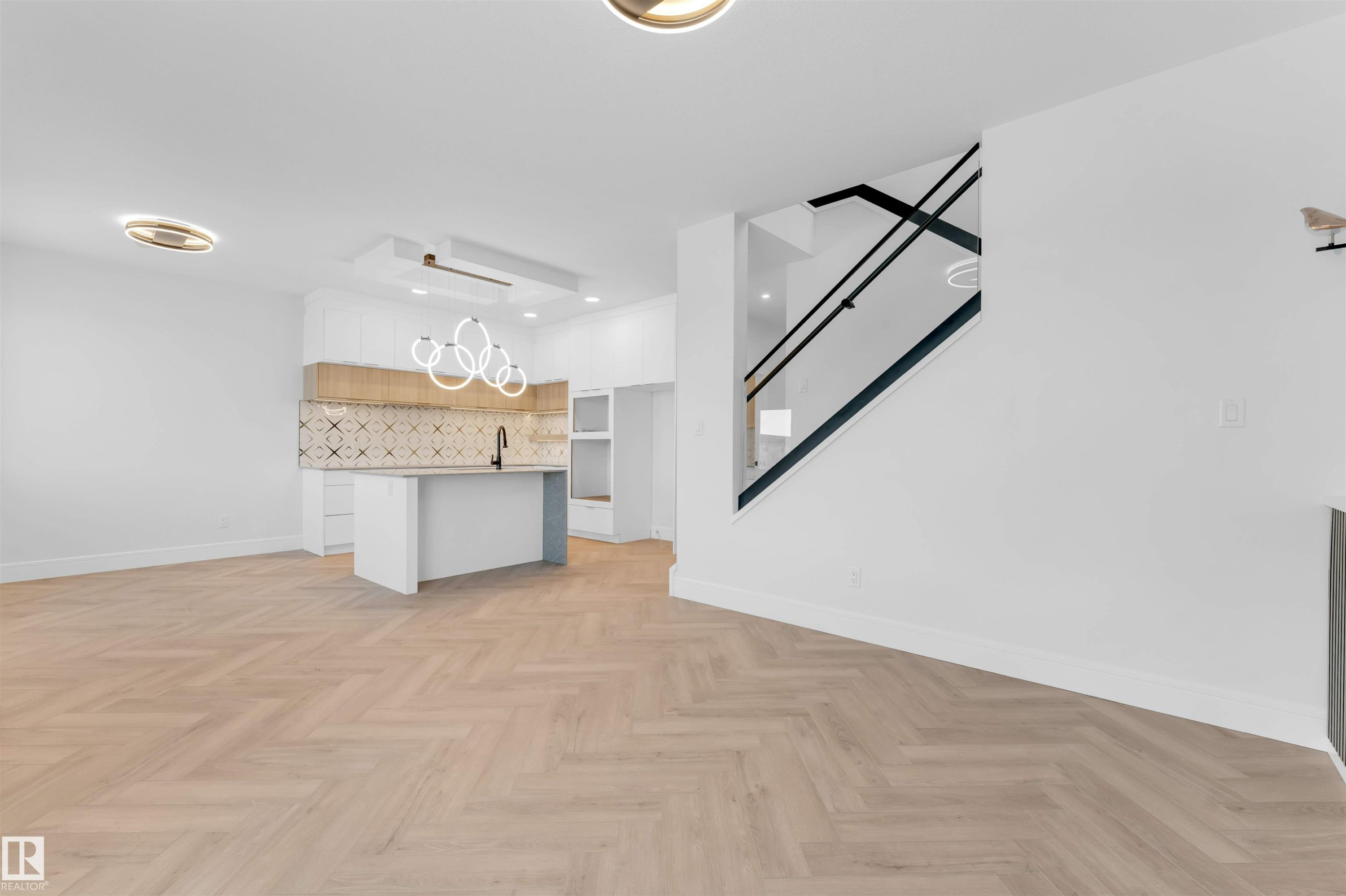 Unfurnished living room featuring baseboards and recessed lighting - 150 Creekside Lane, Leduc, AB - Indoor Photo Showing Kitchen