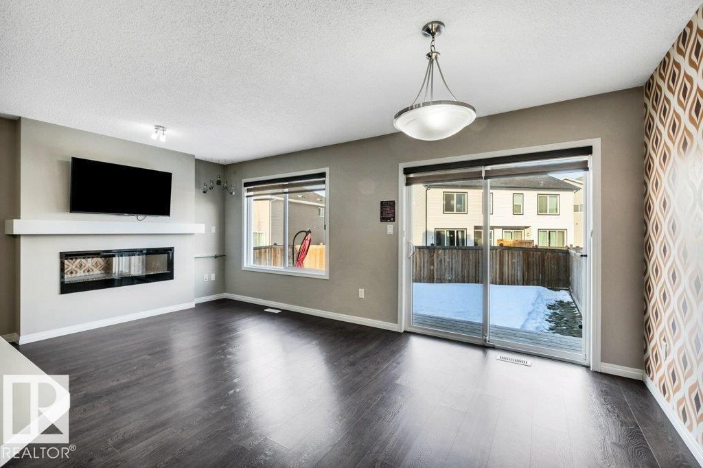 2437 Cassidy Way, Edmonton, AB - Indoor Photo Showing Living Room With Fireplace