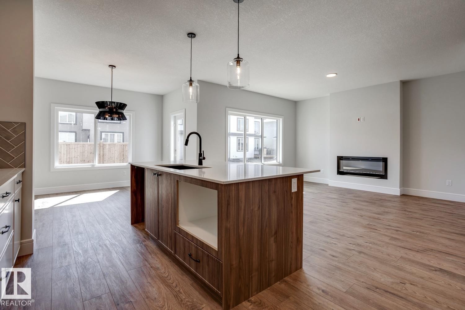 405 Brickyard Point(E), Stony Plain, AB - Indoor Photo Showing Kitchen With Fireplace