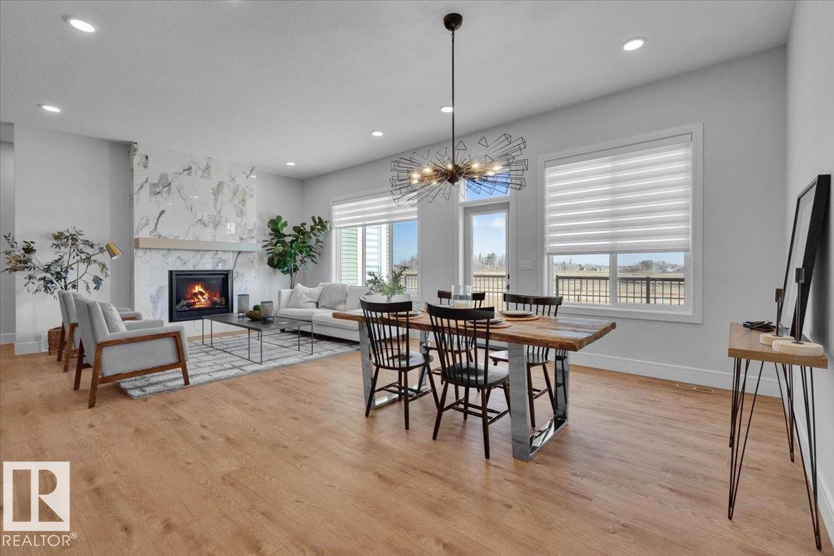 2003 Genesis Lane, Stony Plain, AB - Indoor Photo Showing Dining Room With Fireplace