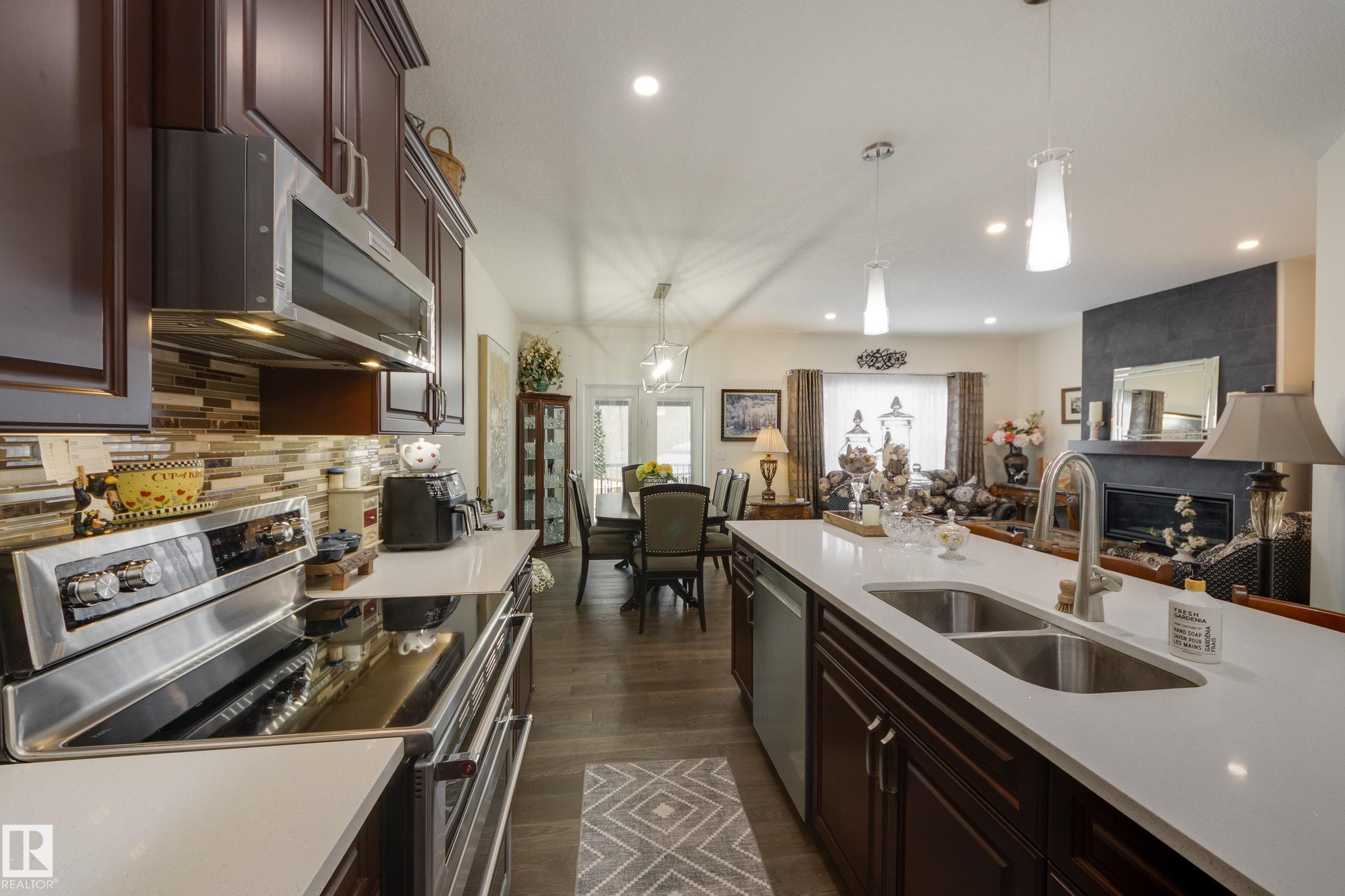 64 Maple Crescent, Gibbons, AB - Indoor Photo Showing Kitchen With Double Sink With Upgraded Kitchen