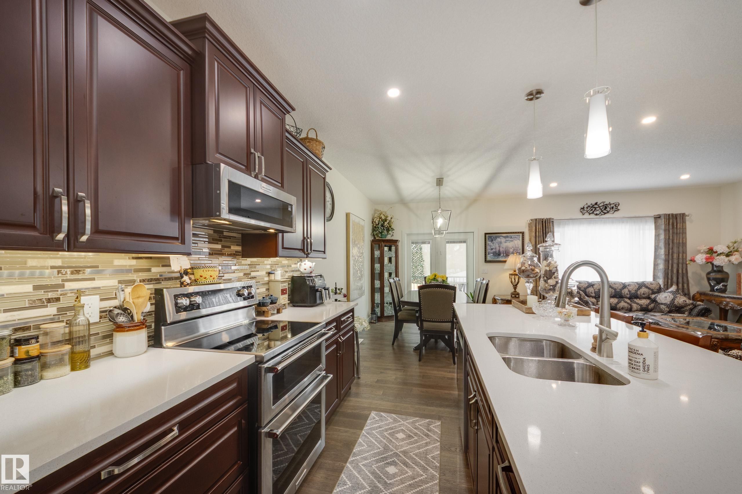 64 Maple Crescent, Gibbons, AB - Indoor Photo Showing Kitchen With Double Sink With Upgraded Kitchen