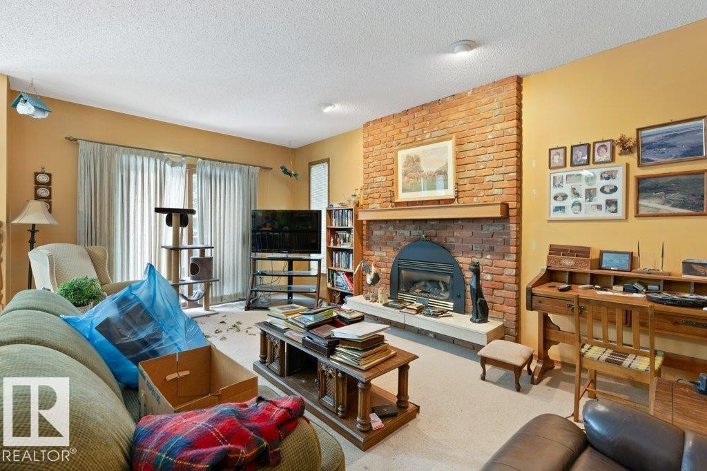 10511 74 Street, Edmonton, AB - Indoor Photo Showing Living Room With Fireplace