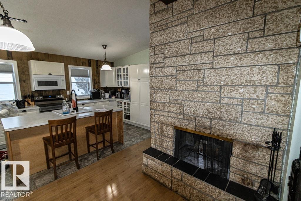 5006 51 St, Myrnam, AB - Indoor With Fireplace
