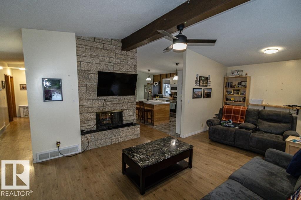 5006 51 St, Myrnam, AB - Indoor Photo Showing Living Room With Fireplace