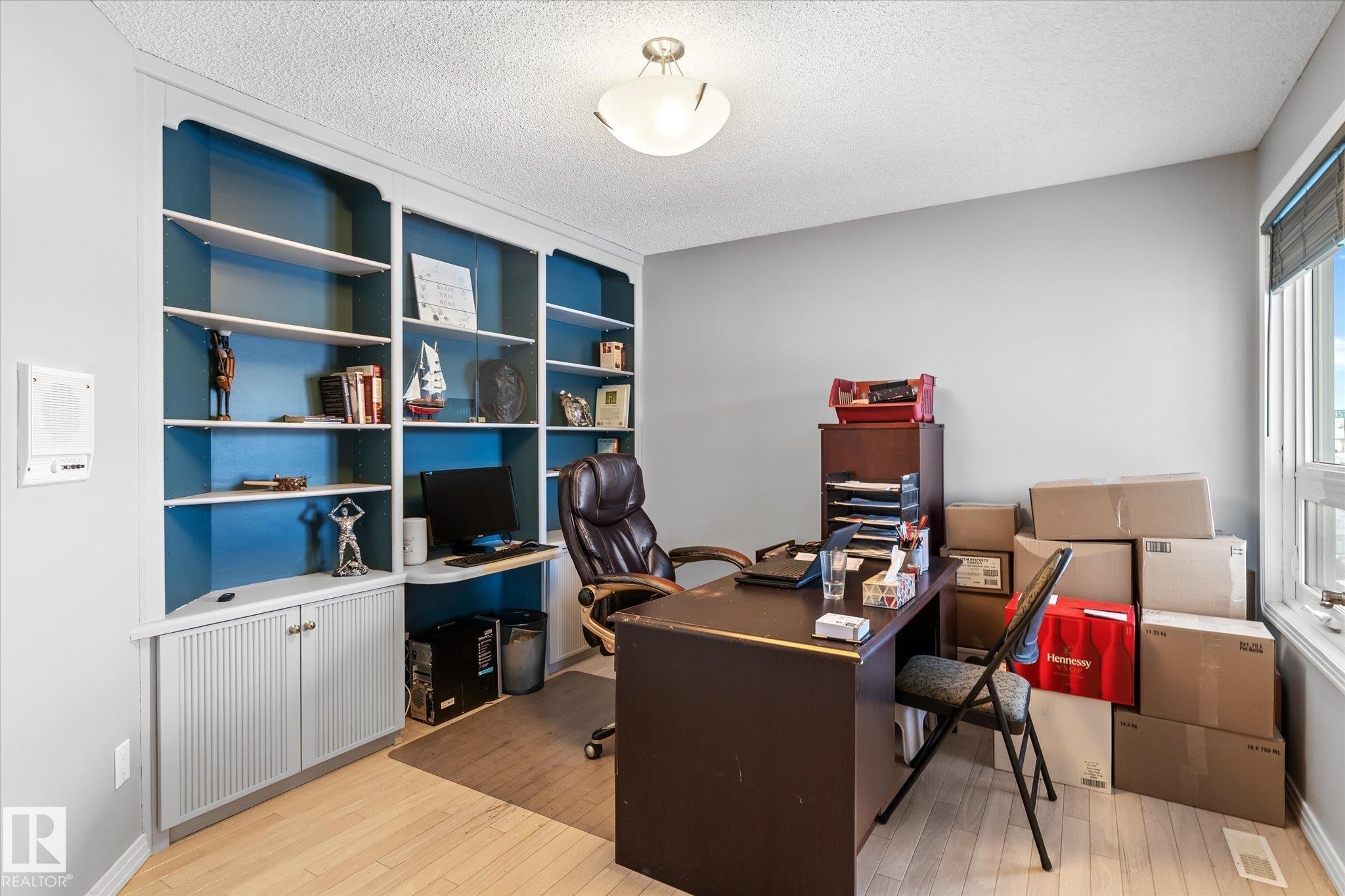 Office area with light wood-type flooring and a textured ceiling - 7020 157 Avenue, Edmonton, AB - Indoor Photo Showing Office