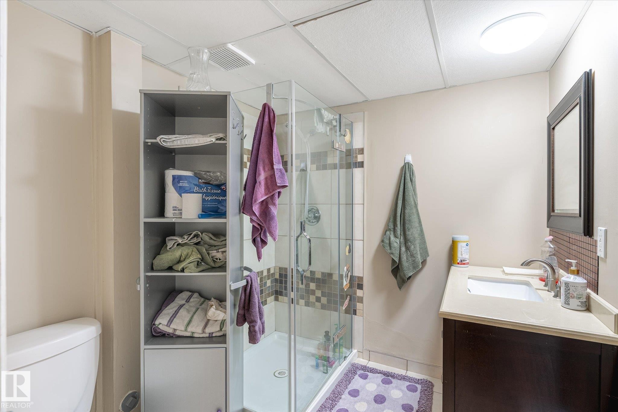 Full bathroom featuring a shower stall, vanity, and tile patterned floors - 7020 157 Avenue, Edmonton, AB - Indoor Photo Showing Bathroom
