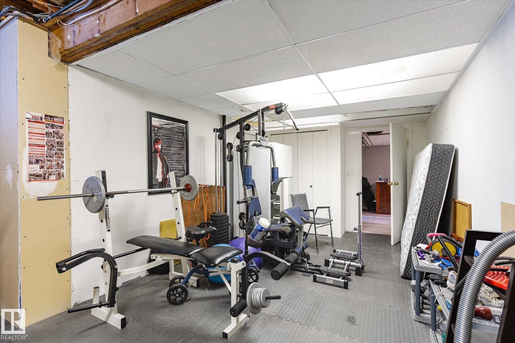Exercise area featuring a paneled ceiling - 7020 157 Avenue, Edmonton, AB - Indoor Photo Showing Gym Room