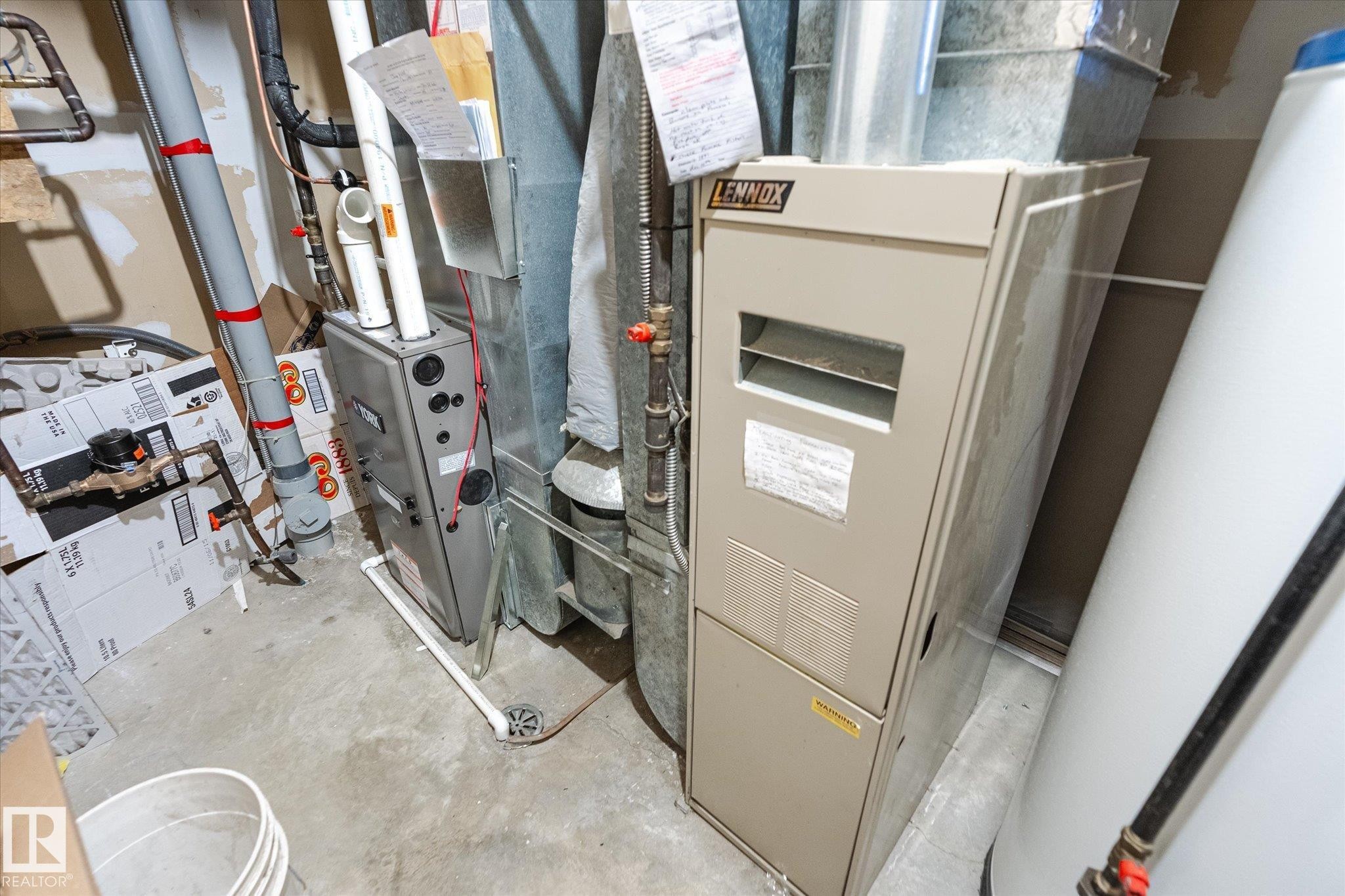 Utilities featuring heating unit - 7020 157 Avenue, Edmonton, AB - Indoor Photo Showing Basement