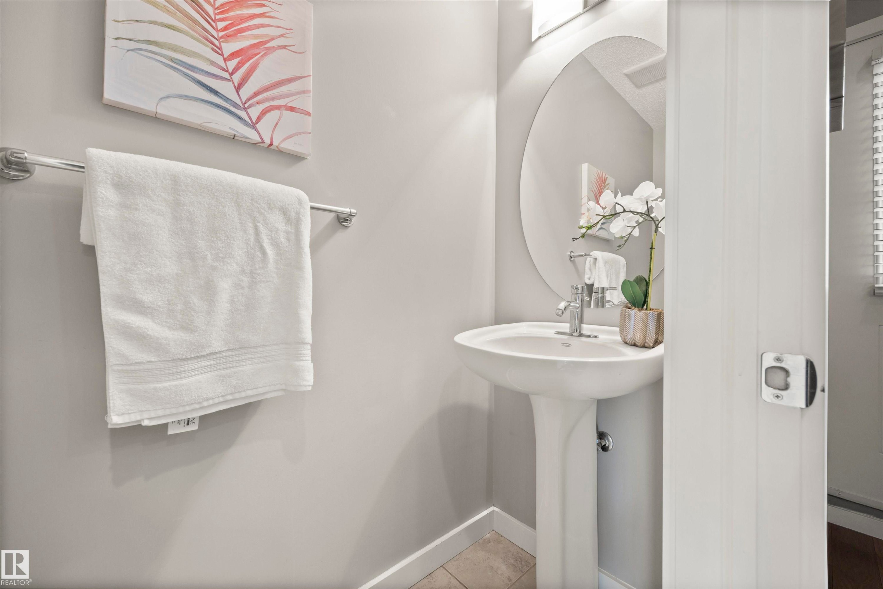 Bathroom with baseboards and tile patterned floors - 56 655 Watt Boulevard, Edmonton, AB - Indoor Photo Showing Bathroom