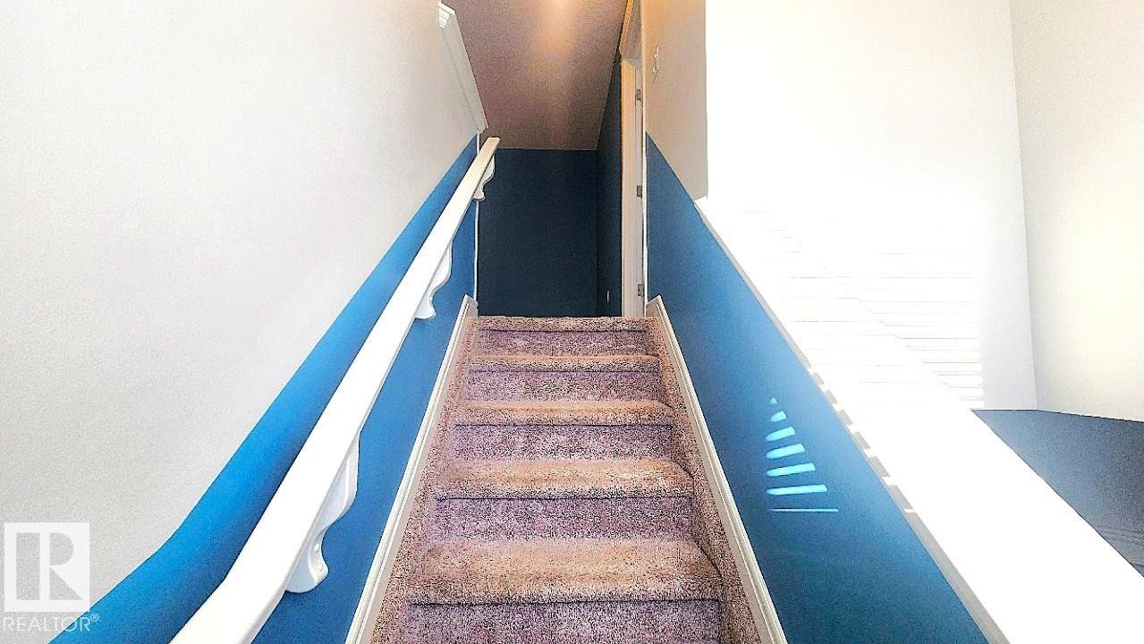 View of staircase - 4610 Kinsella Landing Sw, Edmonton, AB - Indoor Photo Showing Other Room