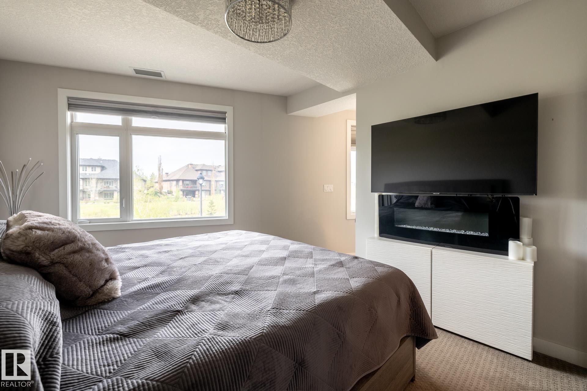 122 5151 Windermere Boulevard, Edmonton, AB - Indoor Photo Showing Bedroom