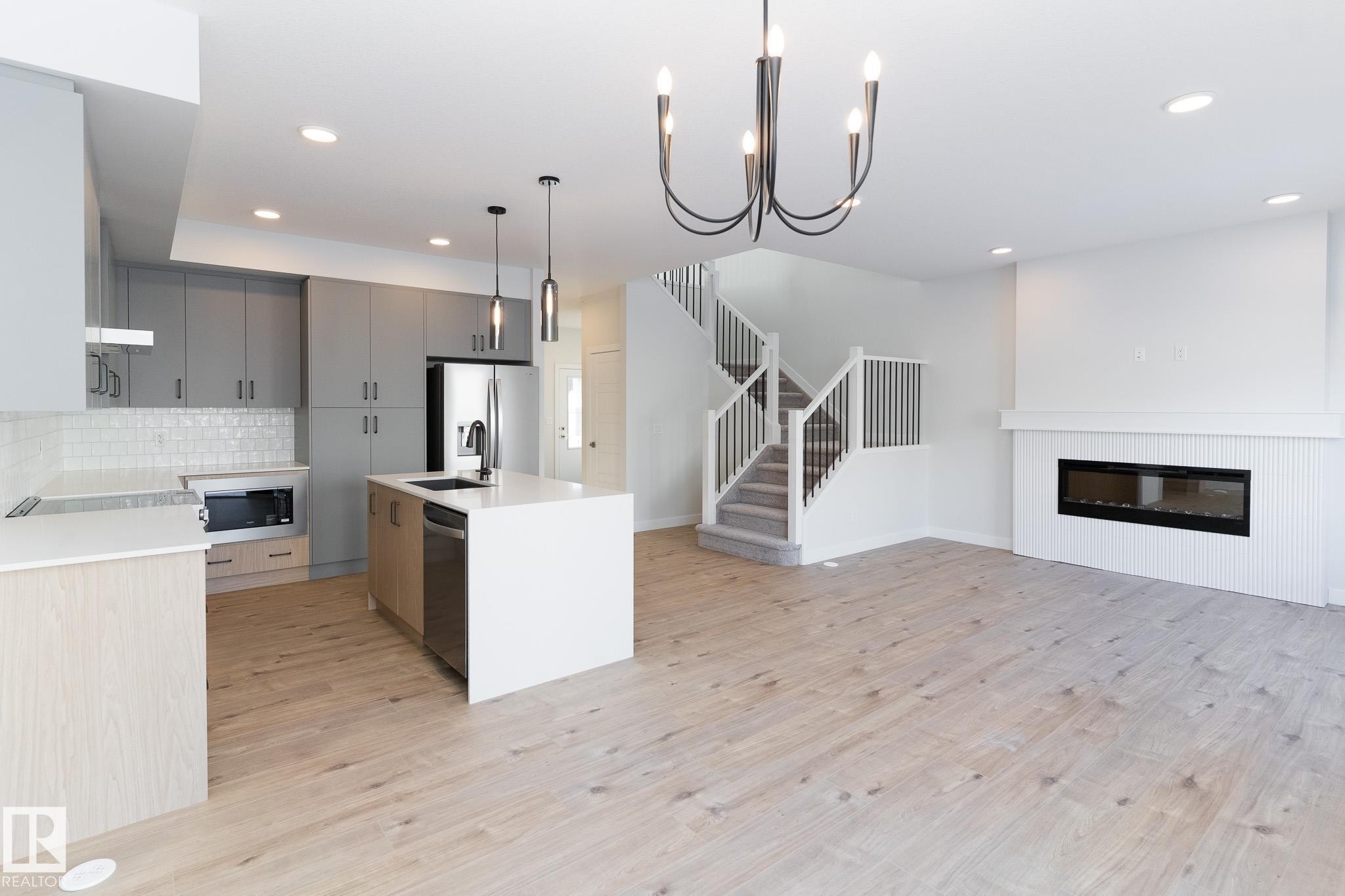3038 Dixon Landing, Edmonton, AB - Indoor Photo Showing Kitchen With Fireplace With Upgraded Kitchen