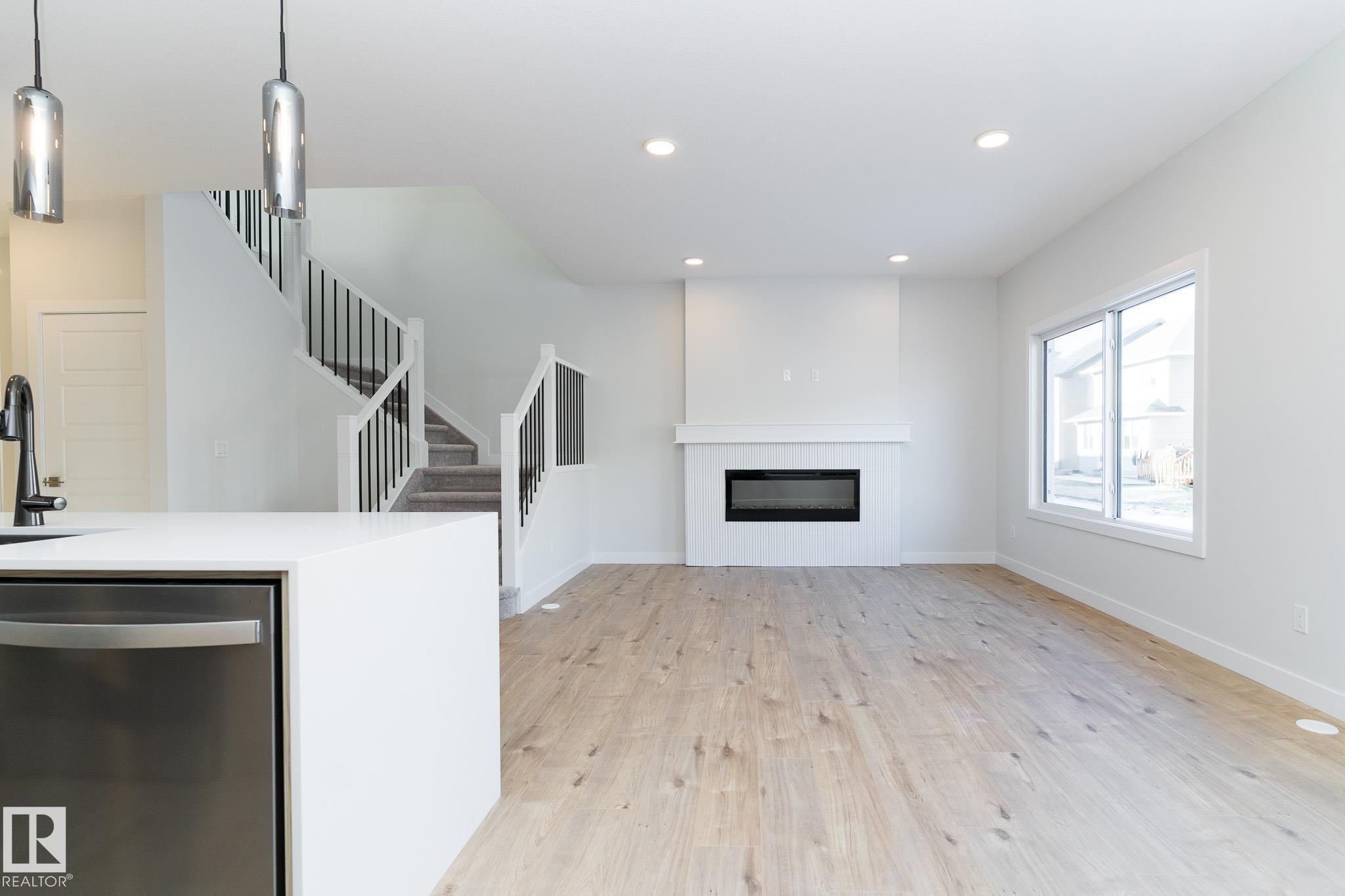 3038 Dixon Landing, Edmonton, AB - Indoor Photo Showing Living Room With Fireplace