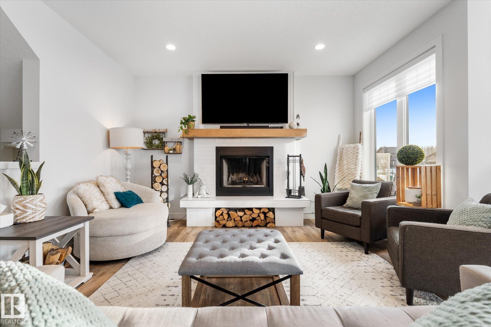 18 3410 Ste. Anne Trail, Rural Lac Ste. Anne County, AB - Indoor Photo Showing Living Room With Fireplace