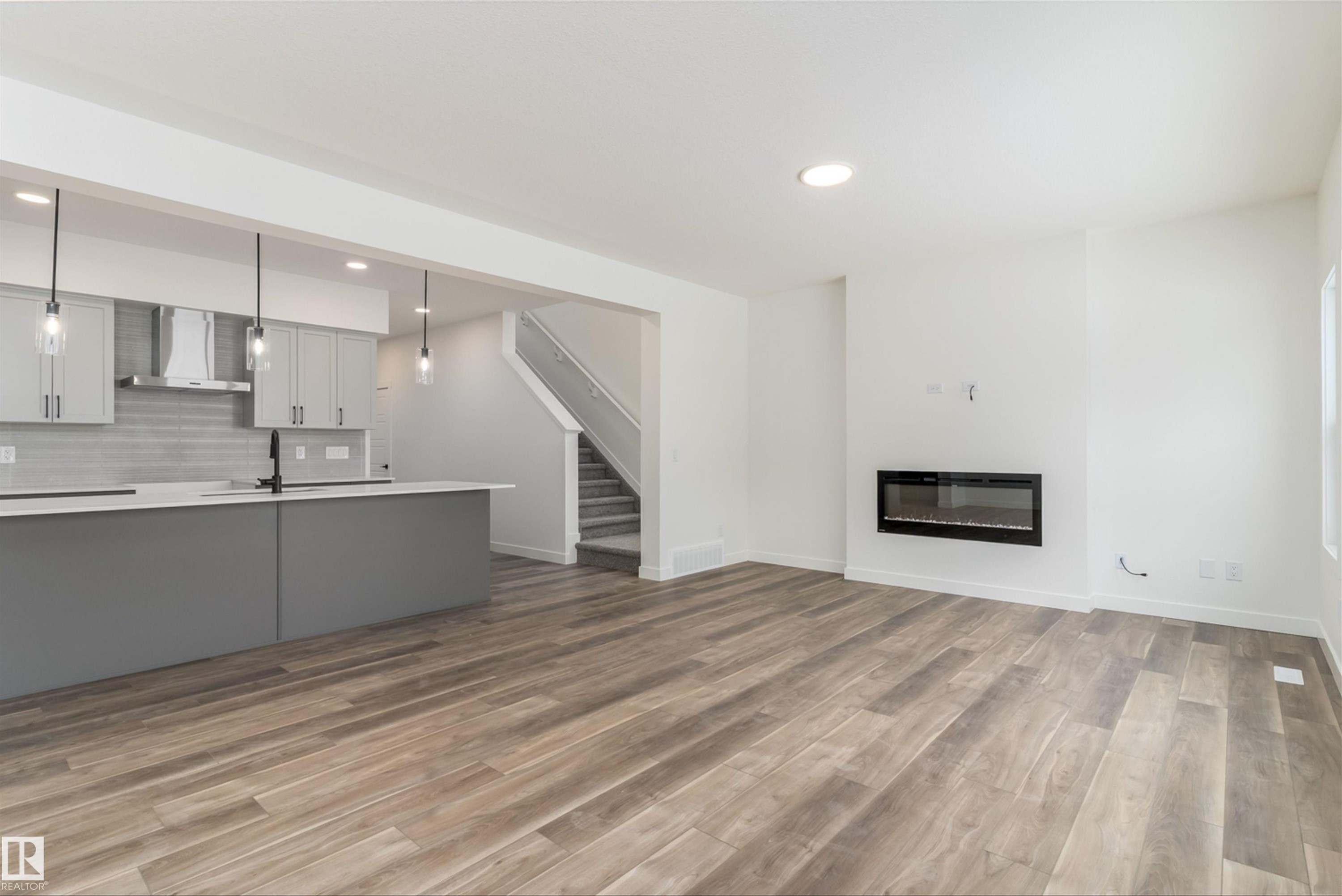 1 Empress Way, Spruce Grove, AB - Indoor Photo Showing Other Room With Fireplace