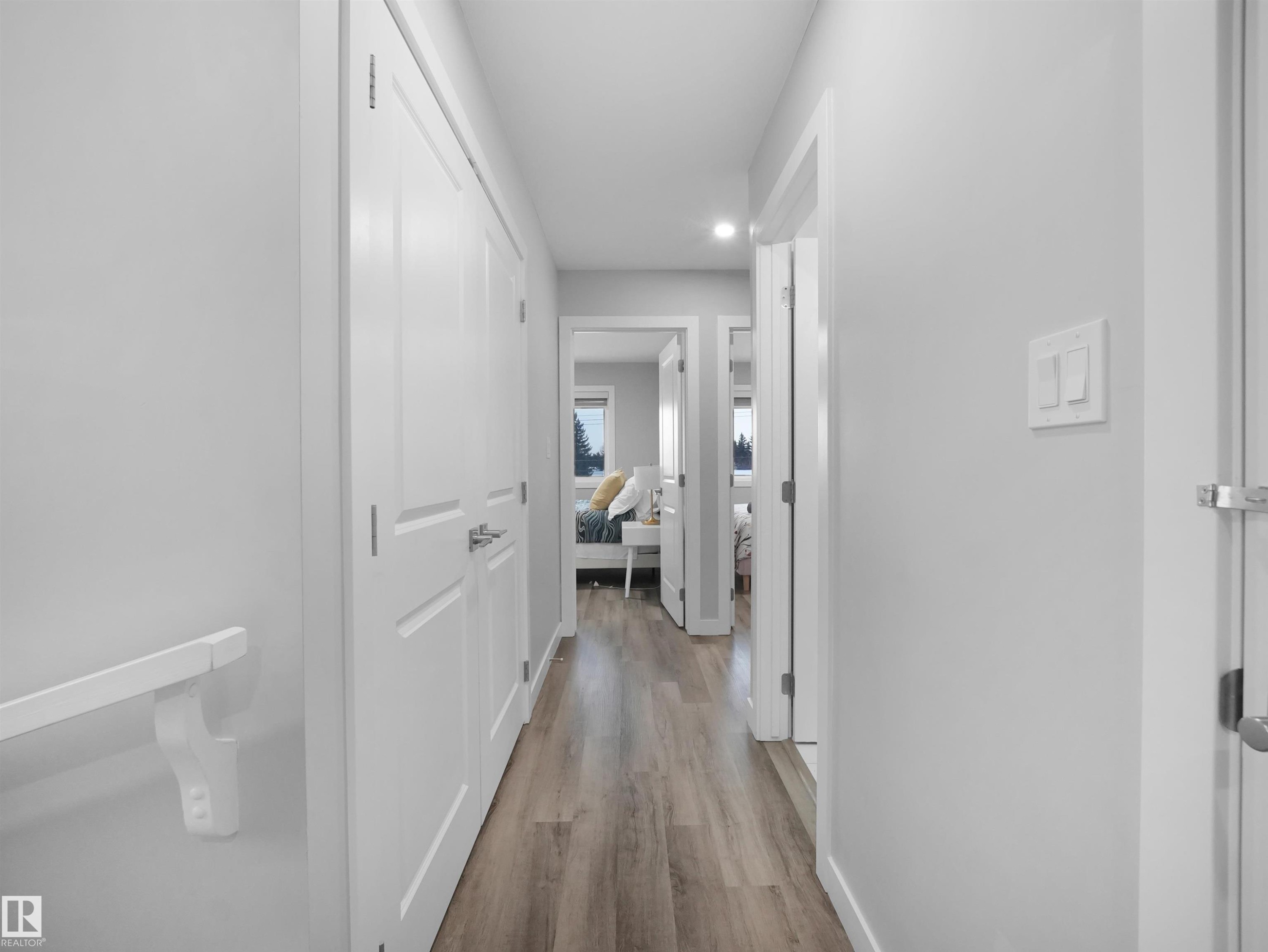 Corridor with light wood-type flooring and recessed lighting - 10911 159 Street, Edmonton, AB - Indoor Photo Showing Other Room