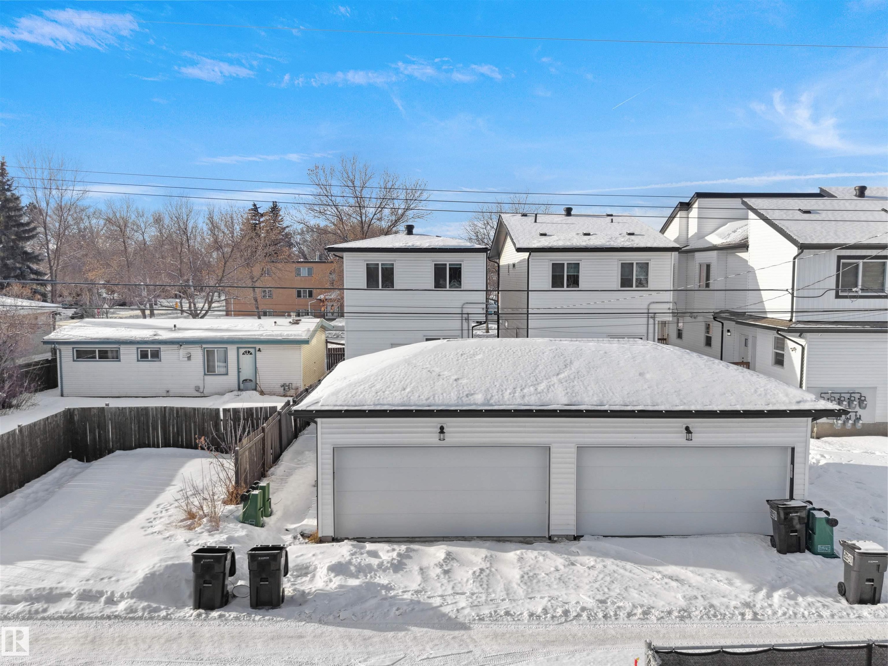 Rear view of property with a residential view, a garage, and an outbuilding - 10911 159 Street, Edmonton, AB - Outdoor