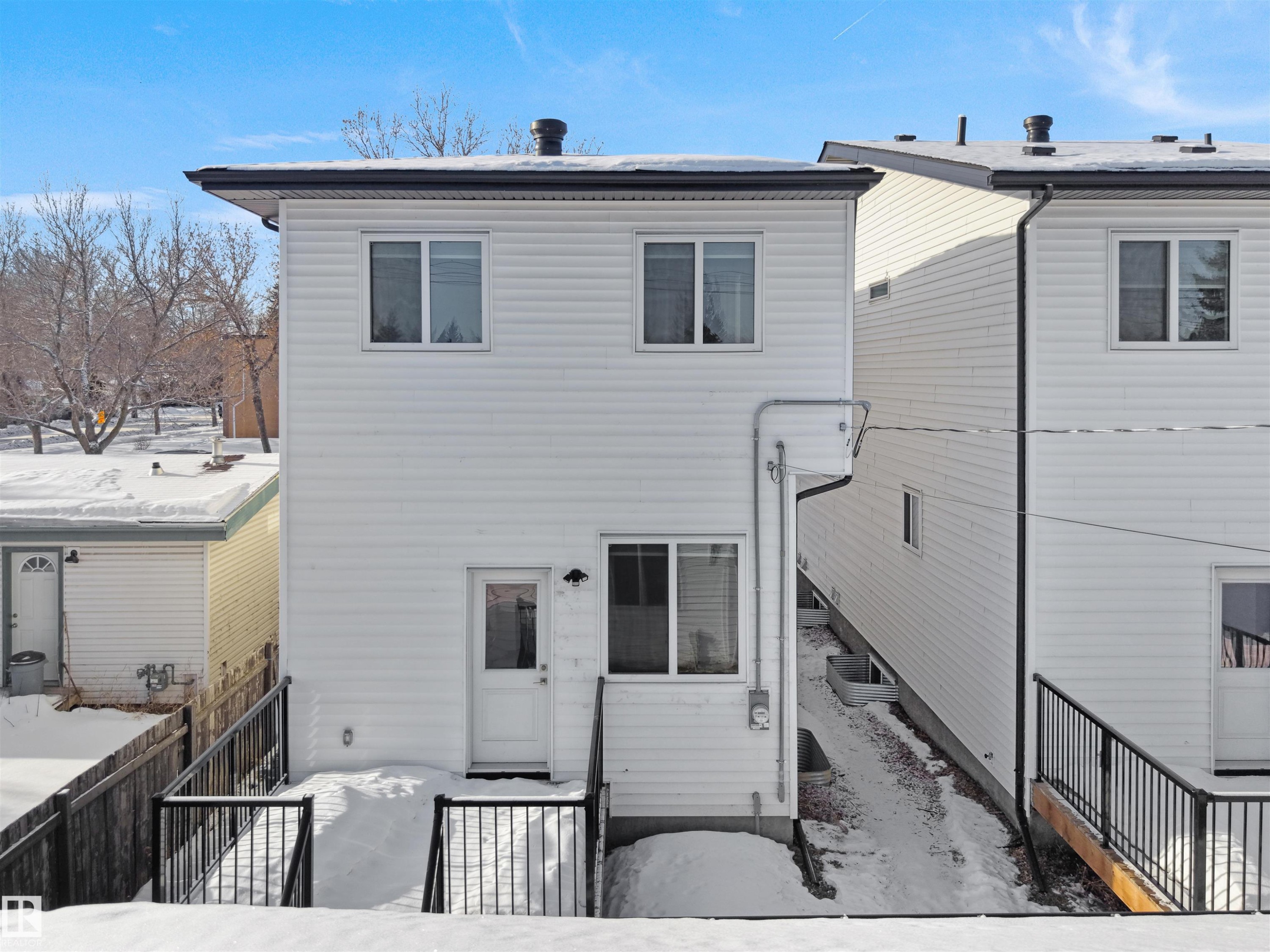 View of snow covered rear of property - 10911 159 Street, Edmonton, AB - Outdoor With Exterior