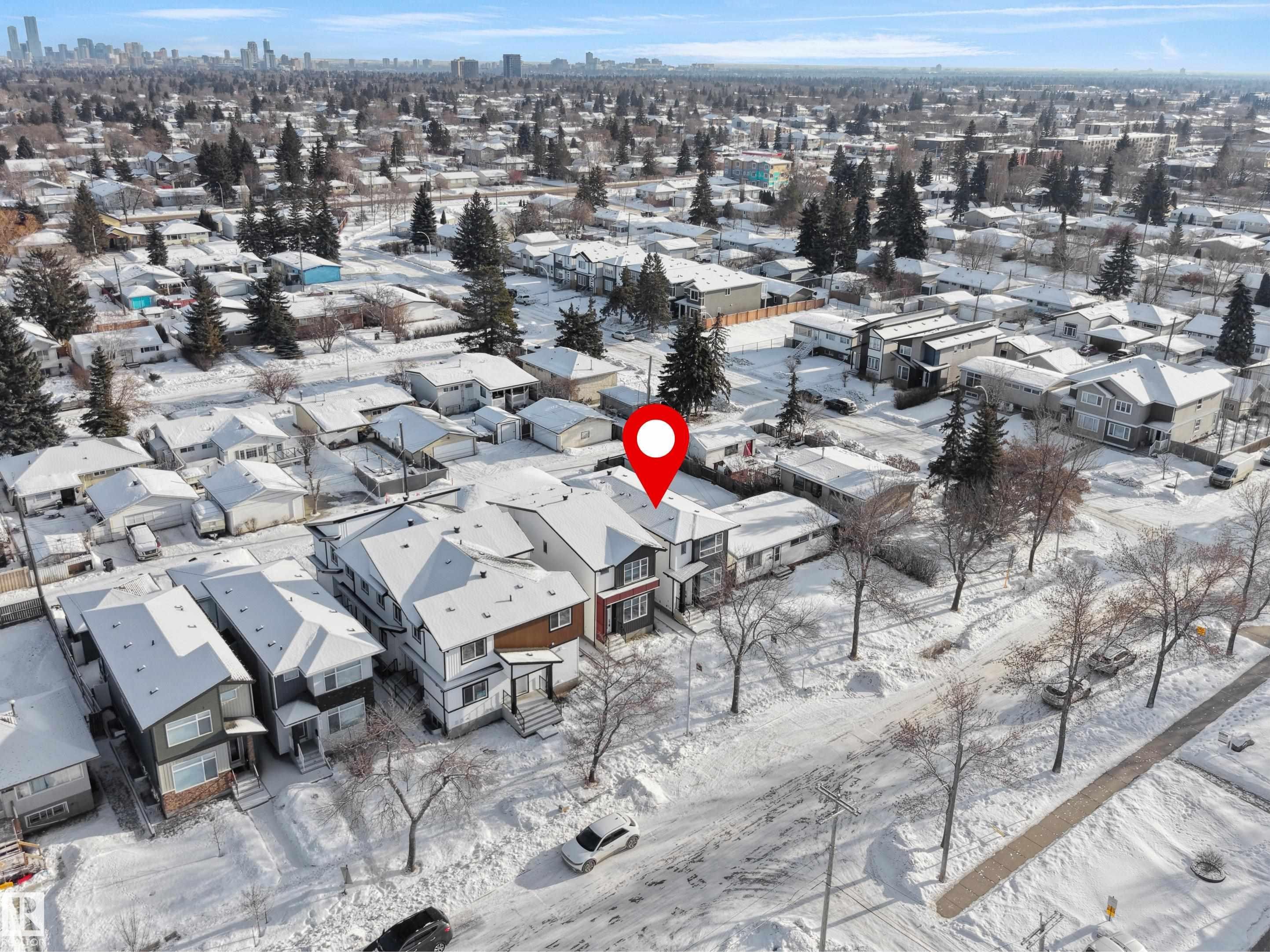 Snowy aerial view featuring a view of skyline - 10911 159 Street, Edmonton, AB - Outdoor With View
