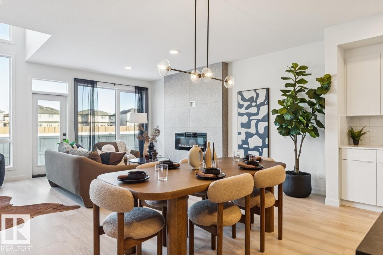 5105 69 Street, Beaumont, AB - Indoor Photo Showing Other Room With Fireplace