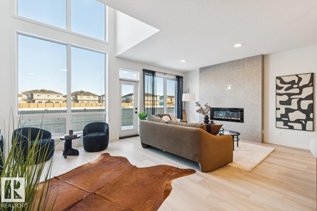 5105 69 Street, Beaumont, AB - Indoor Photo Showing Living Room With Fireplace