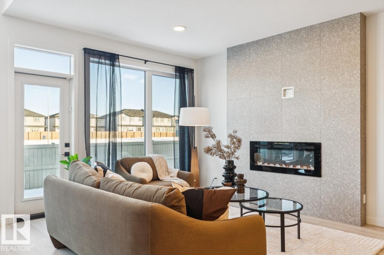 5105 69 Street, Beaumont, AB - Indoor Photo Showing Living Room With Fireplace