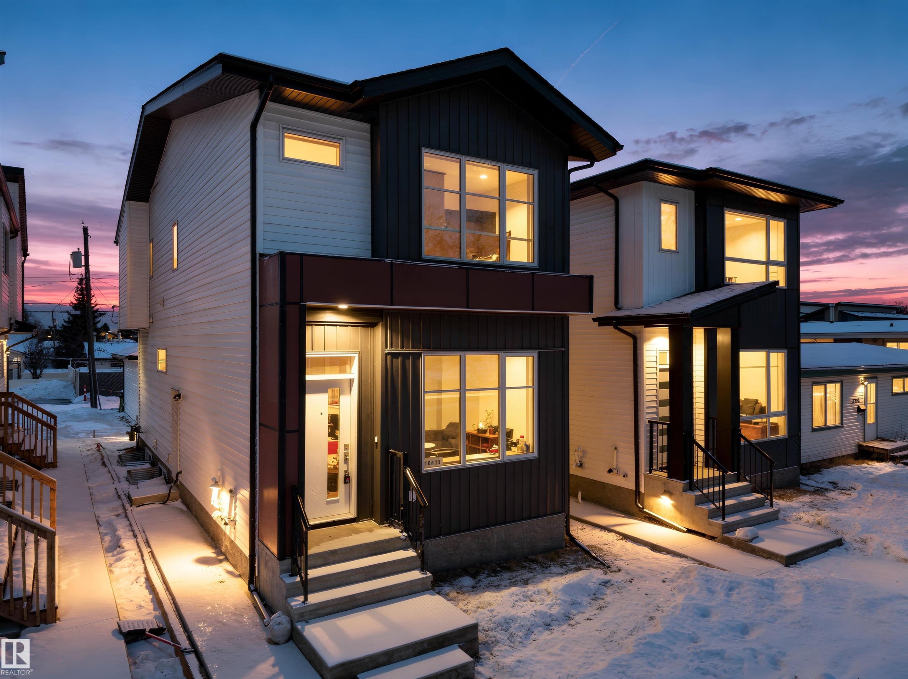 Snow covered property featuring entry steps and board and batten siding - 10913 159 Street, Edmonton, AB - Outdoor