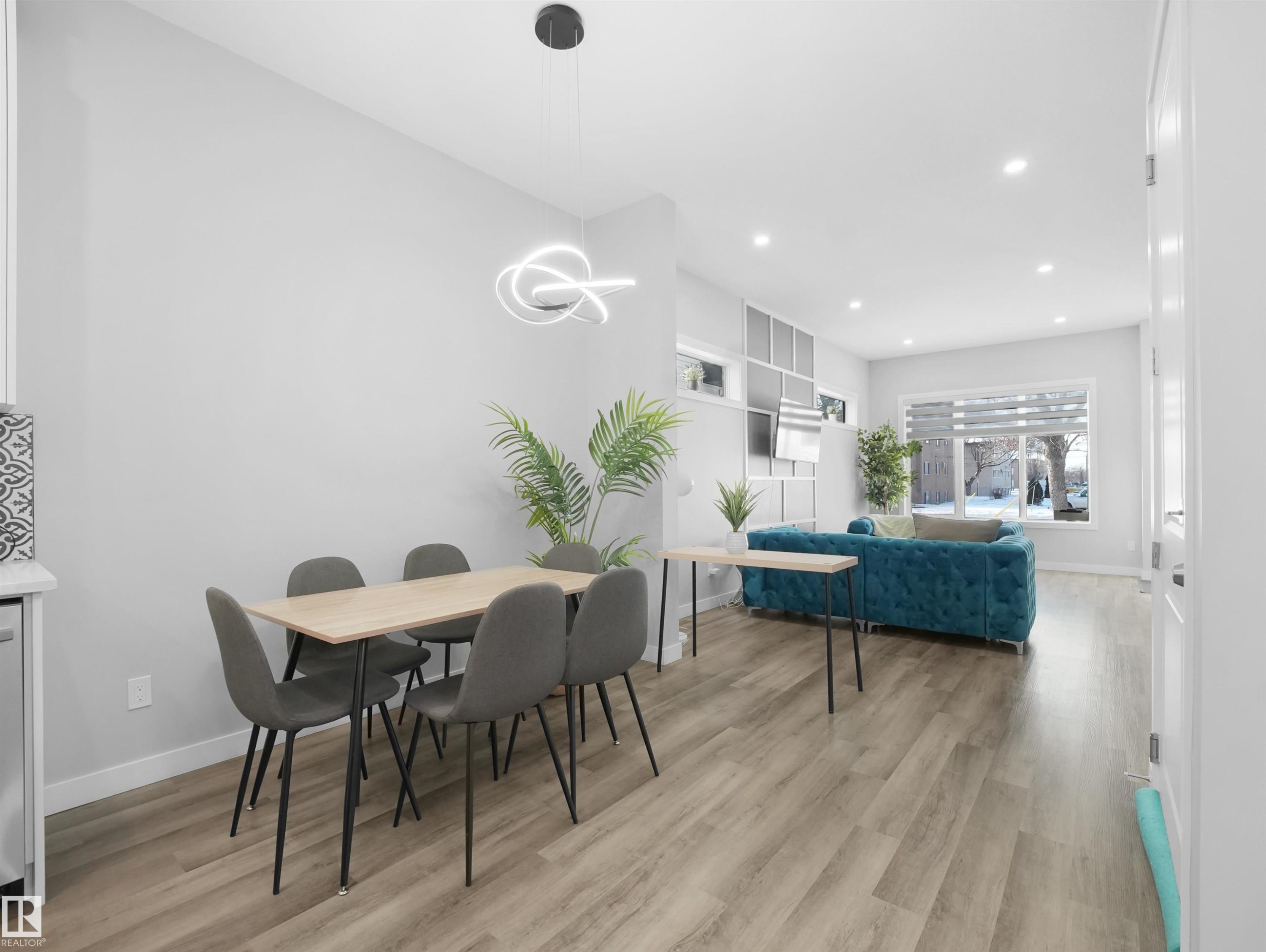 Dining room with light wood finished floors and recessed lighting - 10913 159 Street, Edmonton, AB - Indoor