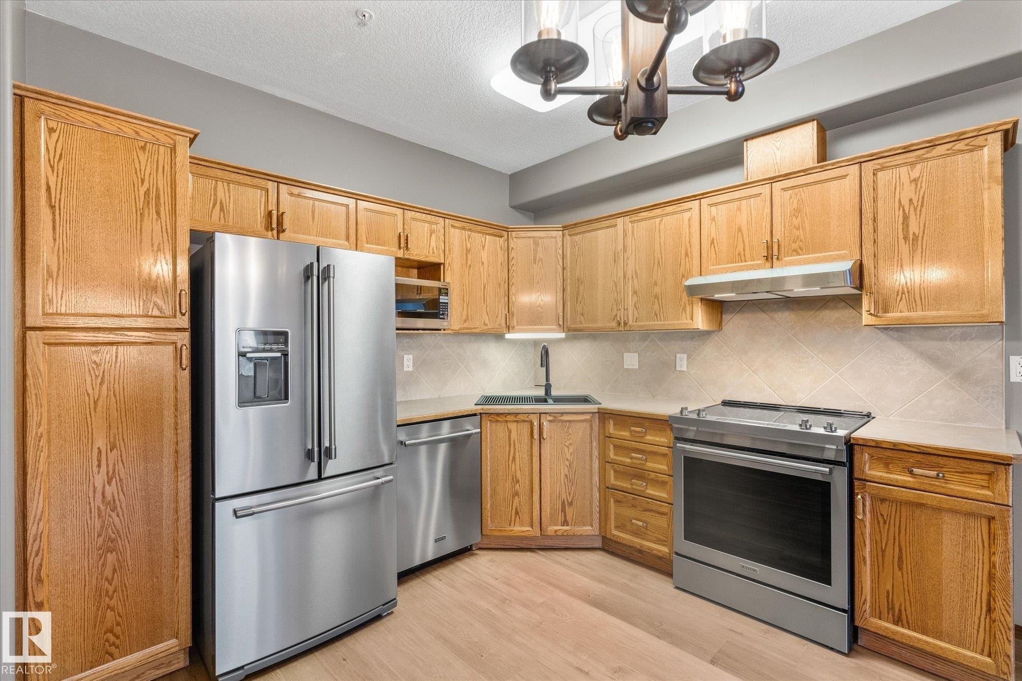 321 11260 153 Avenue, Edmonton, AB - Indoor Photo Showing Kitchen With Stainless Steel Kitchen With Double Sink