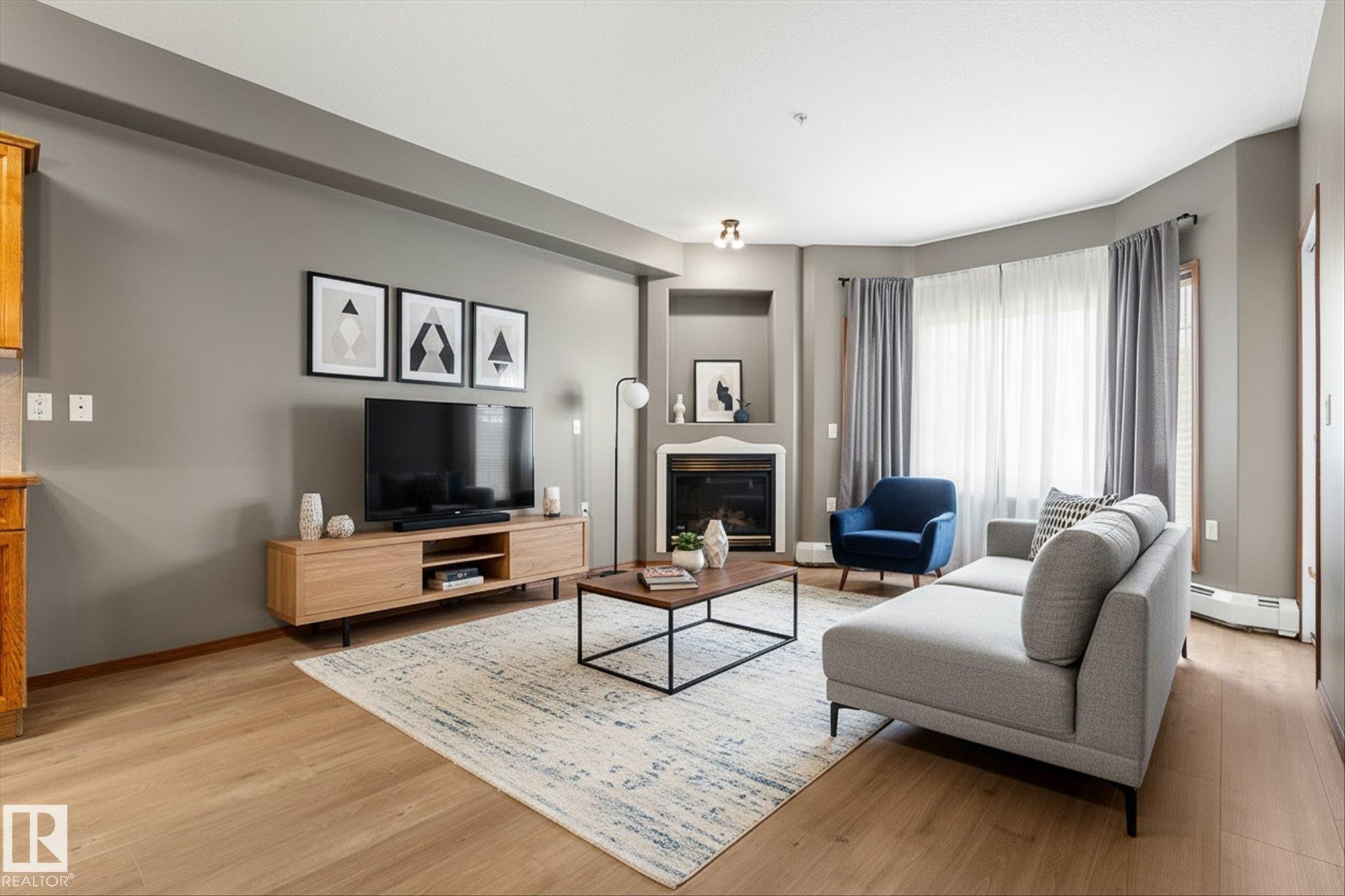 321 11260 153 Avenue, Edmonton, AB - Indoor Photo Showing Living Room With Fireplace