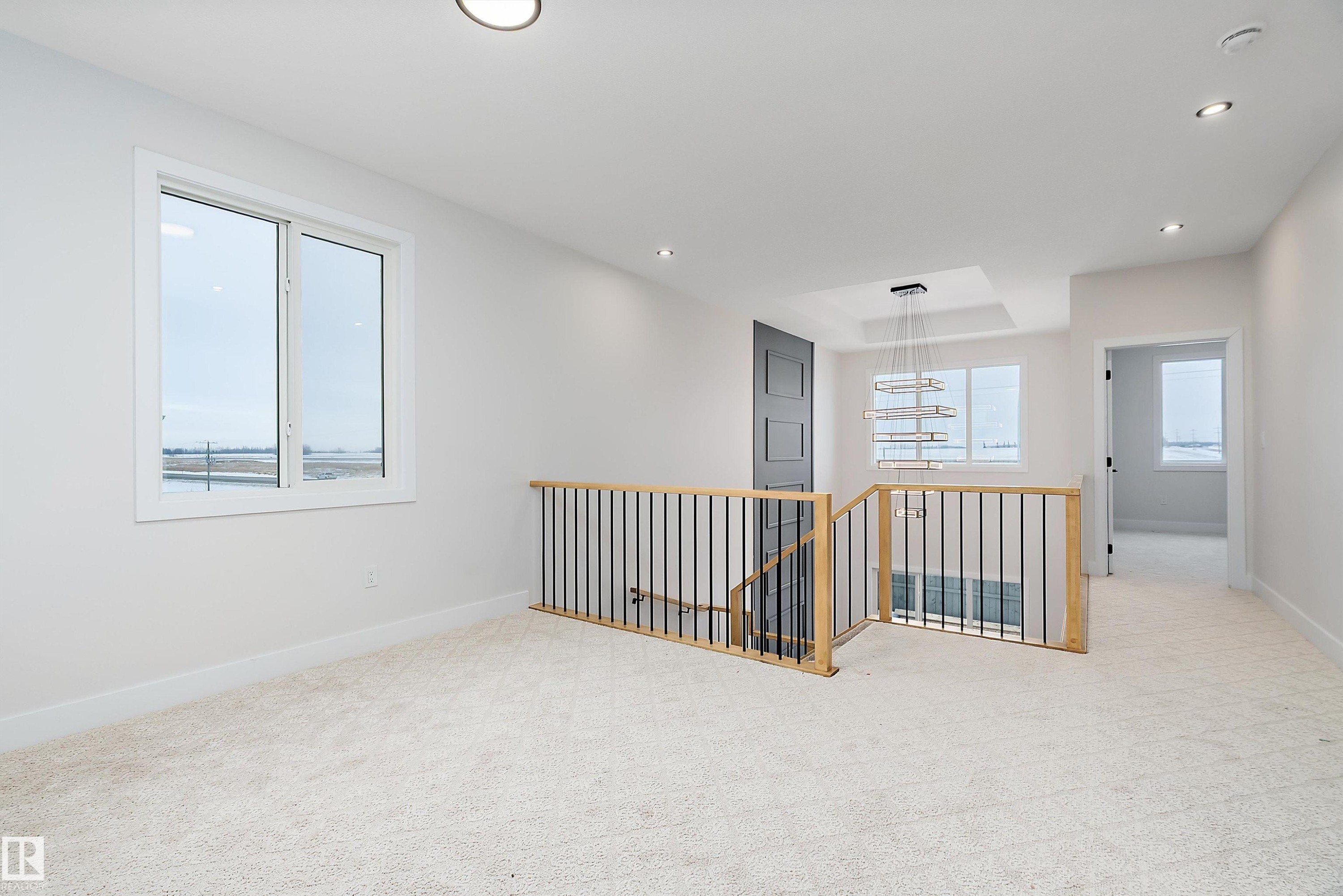 Unfurnished room featuring light colored carpet and recessed lighting - 38 Astoria Place, Devon, AB - Indoor Photo Showing Other Room