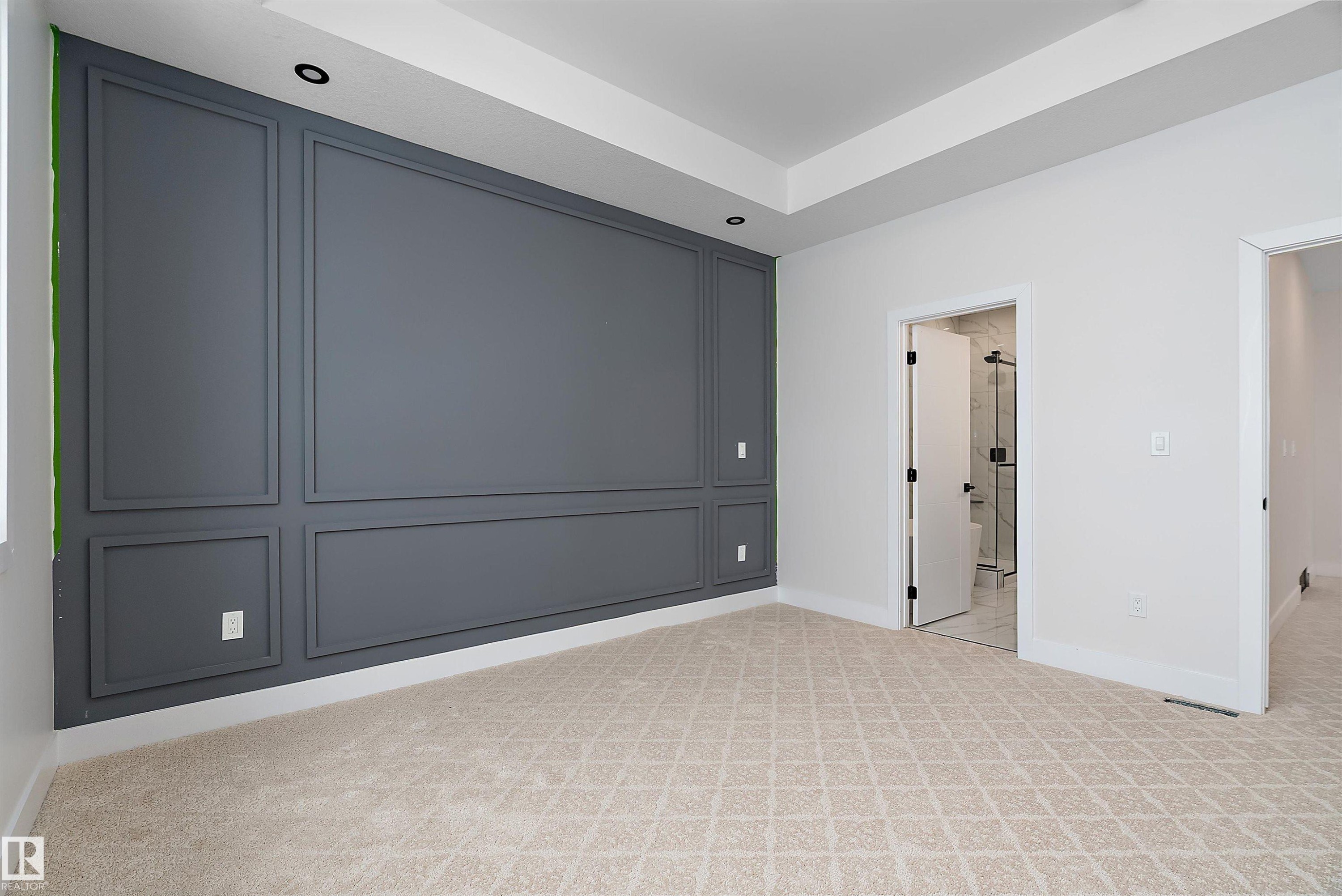 Unfurnished bedroom with light carpet and connected bathroom - 38 Astoria Place, Devon, AB - Indoor Photo Showing Other Room