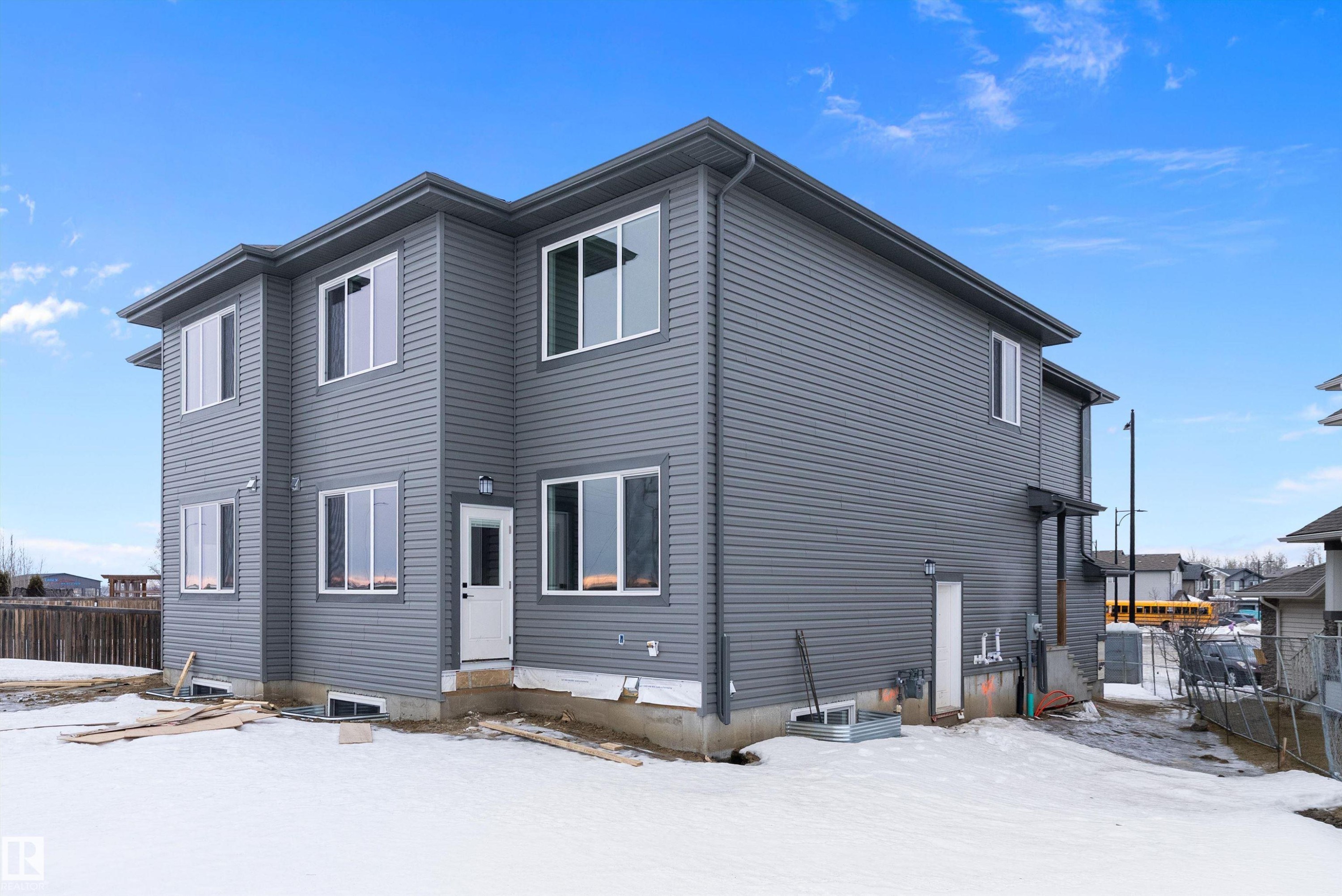 View of snow covered back of property - 38 Astoria Place, Devon, AB - Outdoor