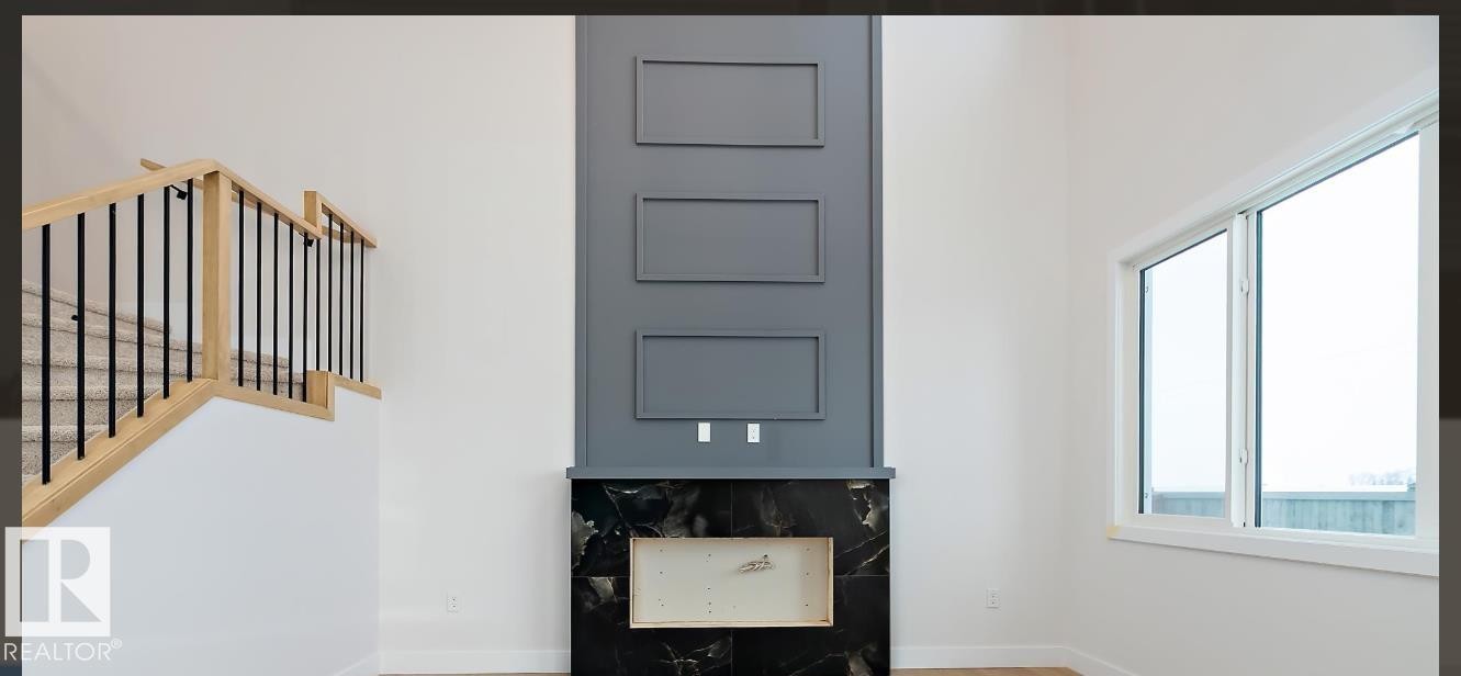 Foyer entrance featuring stairway and baseboards - 38 Astoria Place, Devon, AB - Indoor Photo Showing Other Room
