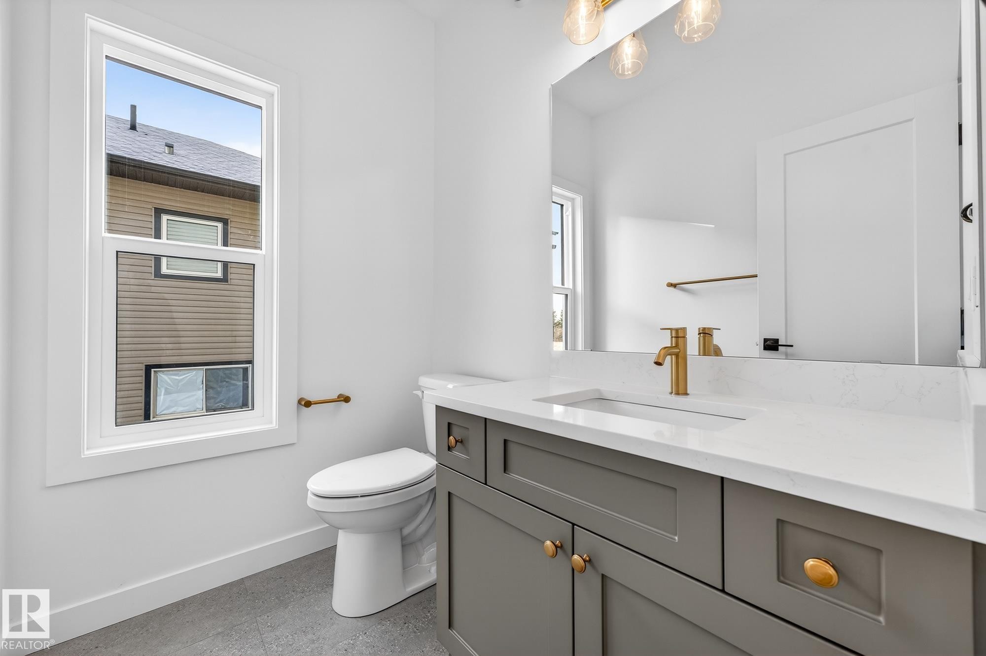 Bathroom featuring vanity and baseboards - 132 Heron Point Close, Rural Wetaskiwin County, AB - Indoor Photo Showing Bathroom