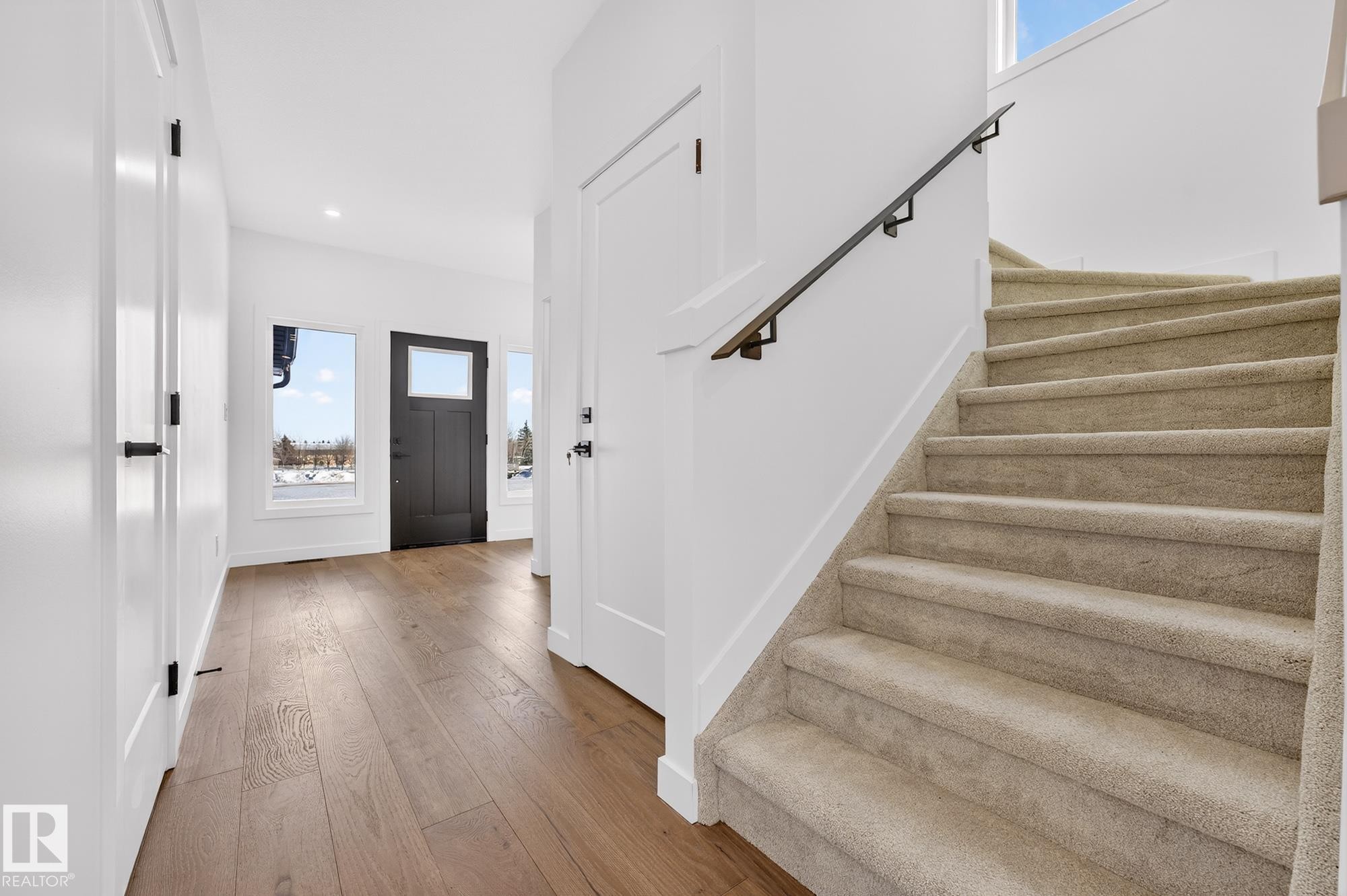 Entrance foyer featuring stairs, light wood-type flooring, and recessed lighting - 132 Heron Point Close, Rural Wetaskiwin County, AB - Indoor Photo Showing Other Room