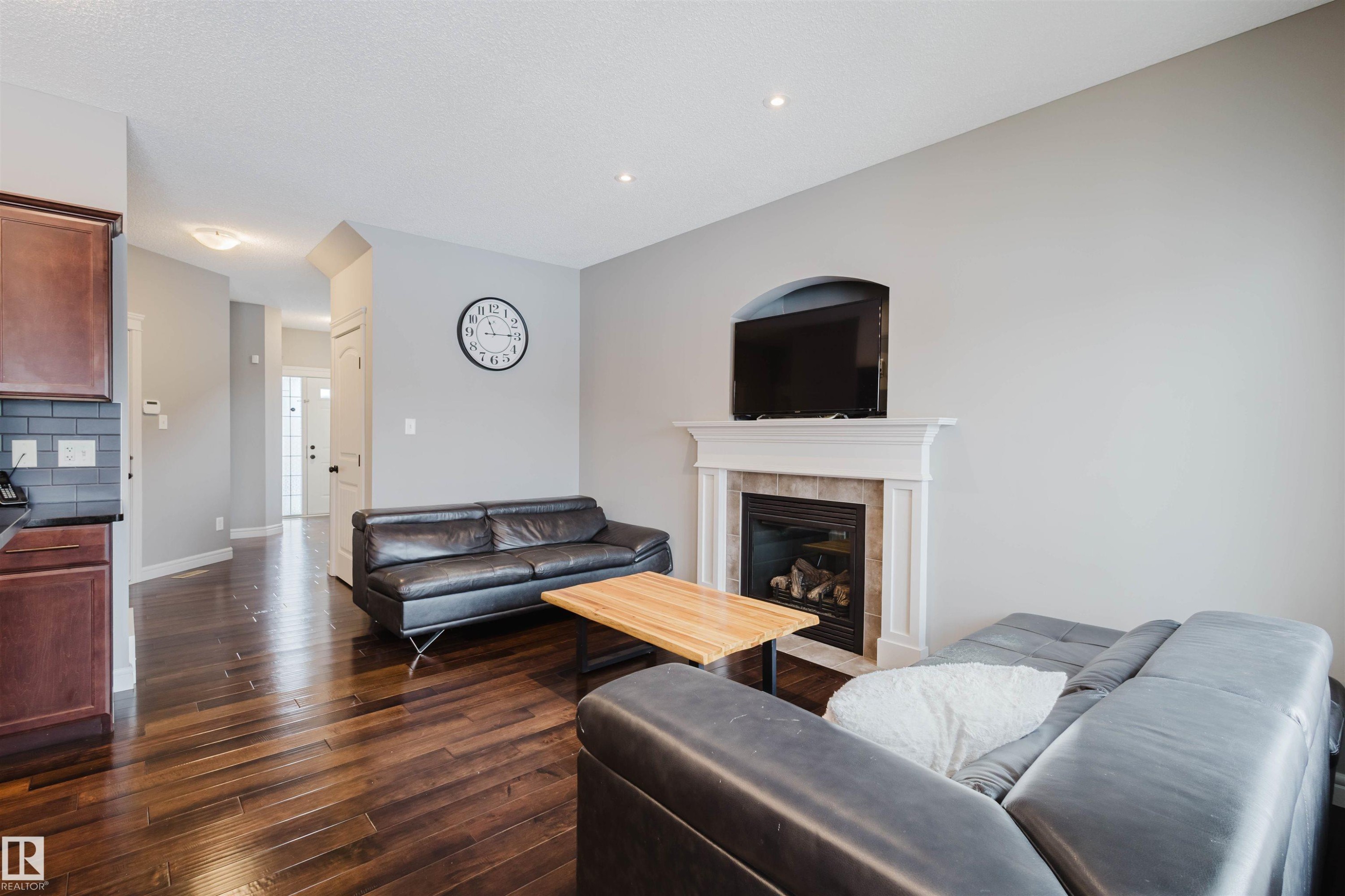 3921 167A Avenue, Edmonton, AB - Indoor Photo Showing Living Room With Fireplace
