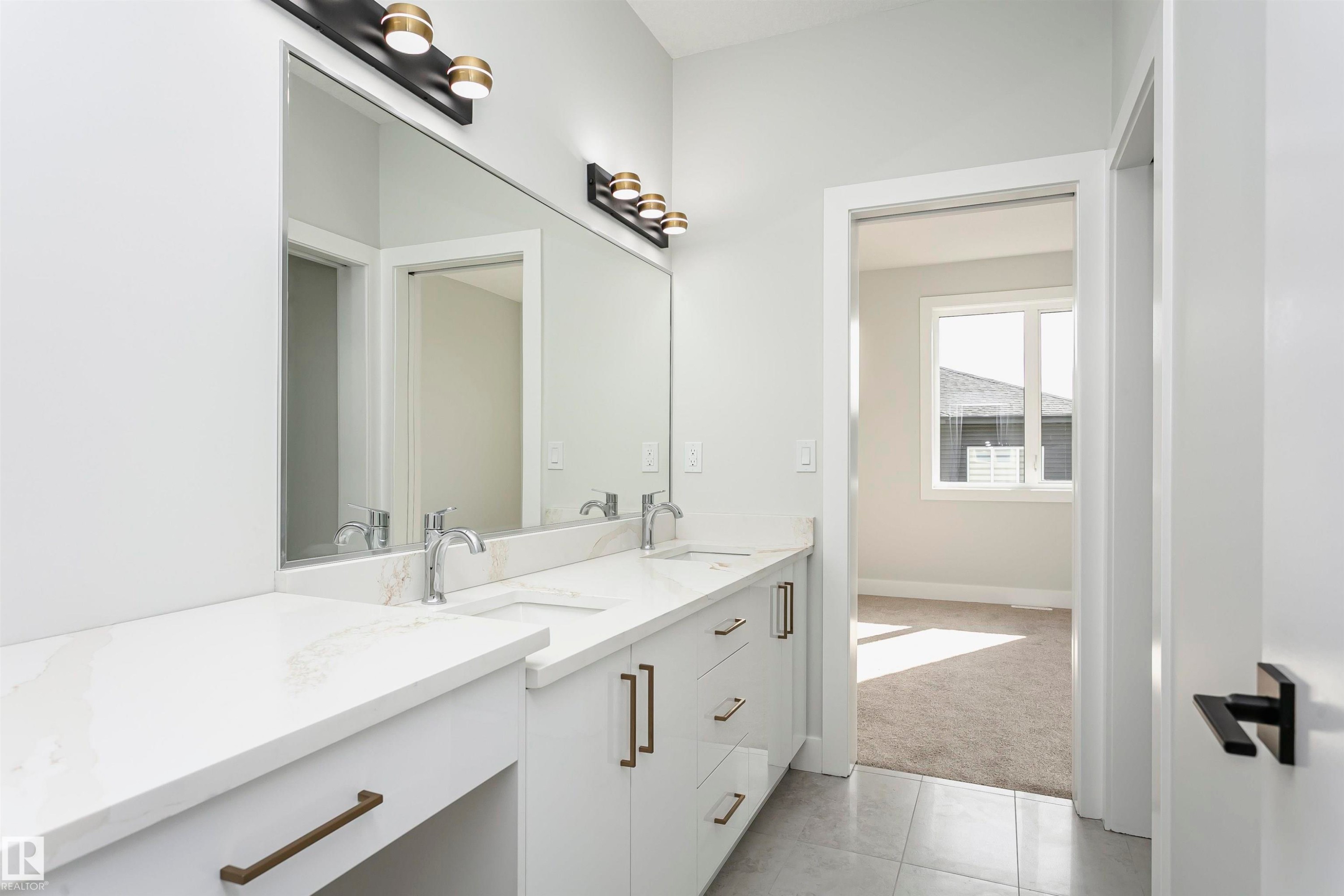 Bathroom with double vanity, light carpet, and light tile patterned floors - 1723 19 Street, Edmonton, AB - Indoor Photo Showing Bathroom