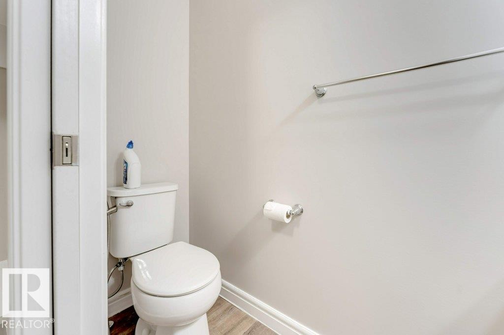 Bathroom with toilet and wood finished floors - 1423 24 Street, Edmonton, AB - Indoor Photo Showing Bathroom