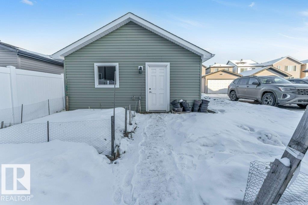 View of snow covered house - 1423 24 Street, Edmonton, AB - Outdoor With Exterior