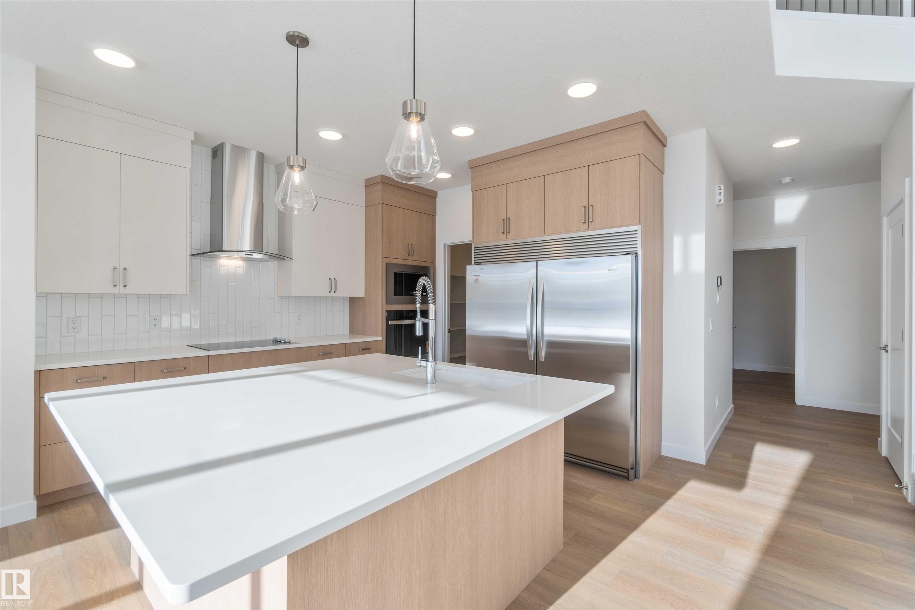 Kitchen featuring light brown cabinets, modern cabinets, decorative backsplash, black appliances, and recessed lighting - 2215 4 Avenue, Edmonton, AB - Indoor Photo Showing Kitchen With Upgraded Kitchen