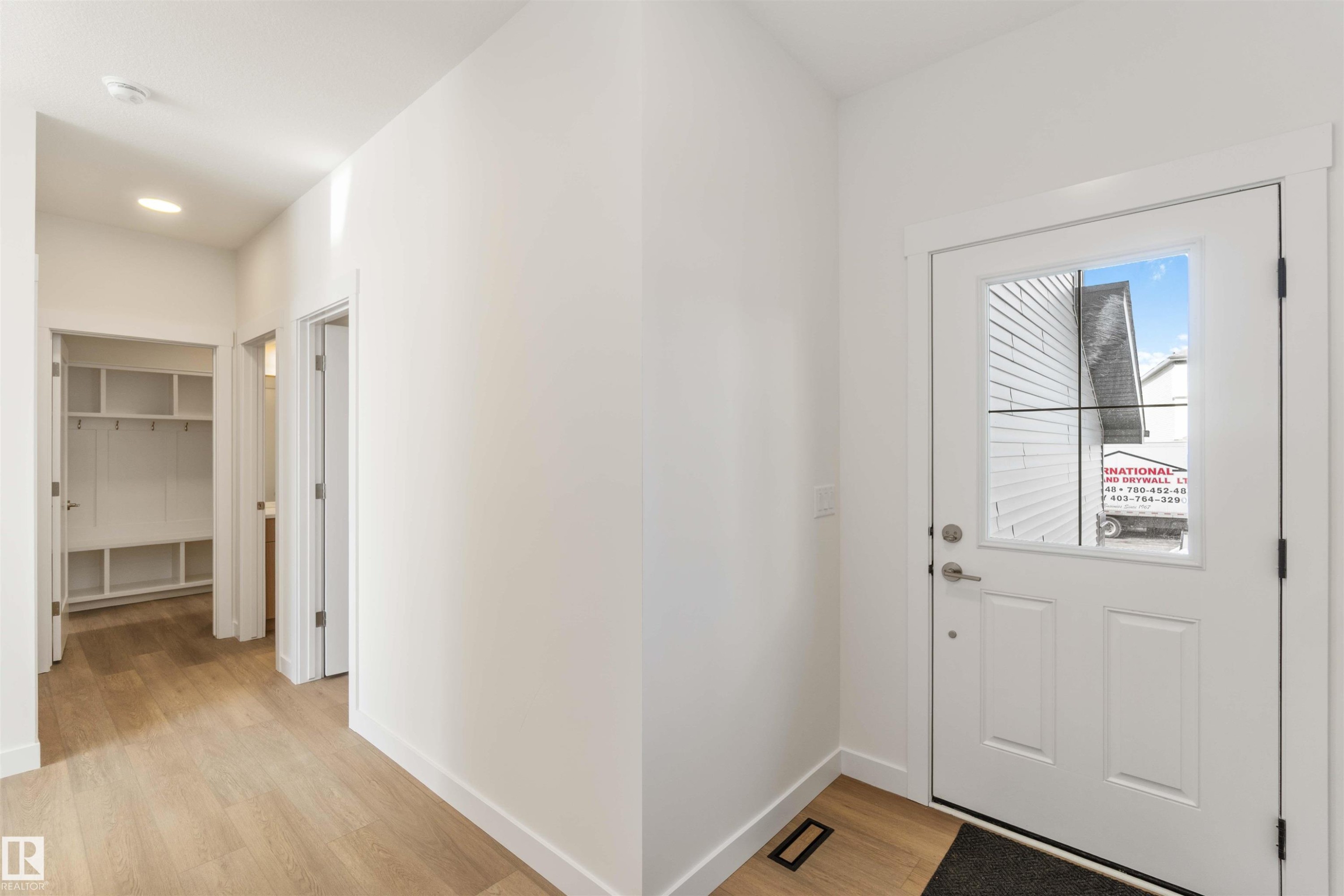 Entrance foyer featuring light wood finished floors and baseboards - 2215 4 Avenue, Edmonton, AB - Indoor Photo Showing Other Room