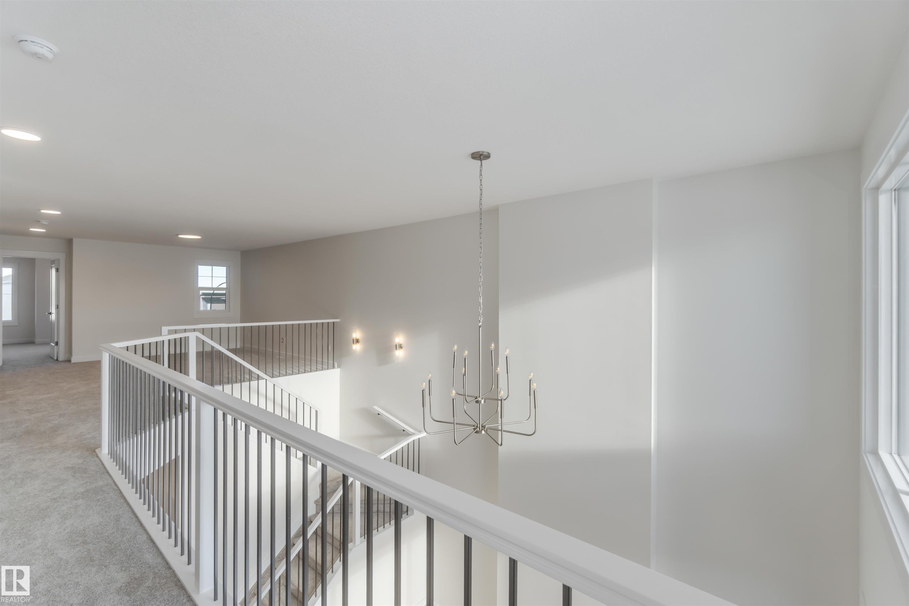Corridor with recessed lighting, carpet, an upstairs landing, and a chandelier - 2215 4 Avenue, Edmonton, AB - Indoor Photo Showing Other Room