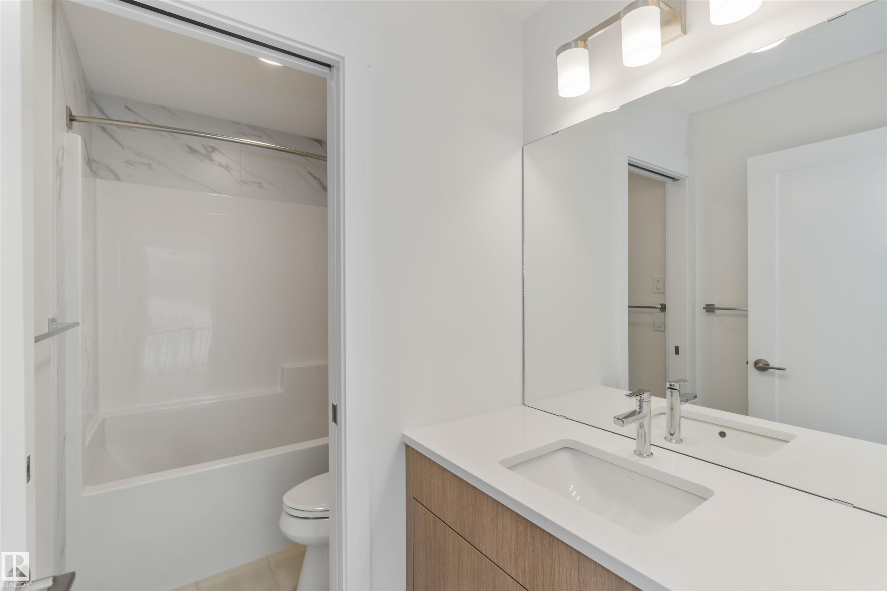 Full bathroom with vanity and tub / shower combination - 2215 4 Avenue, Edmonton, AB - Indoor Photo Showing Bathroom