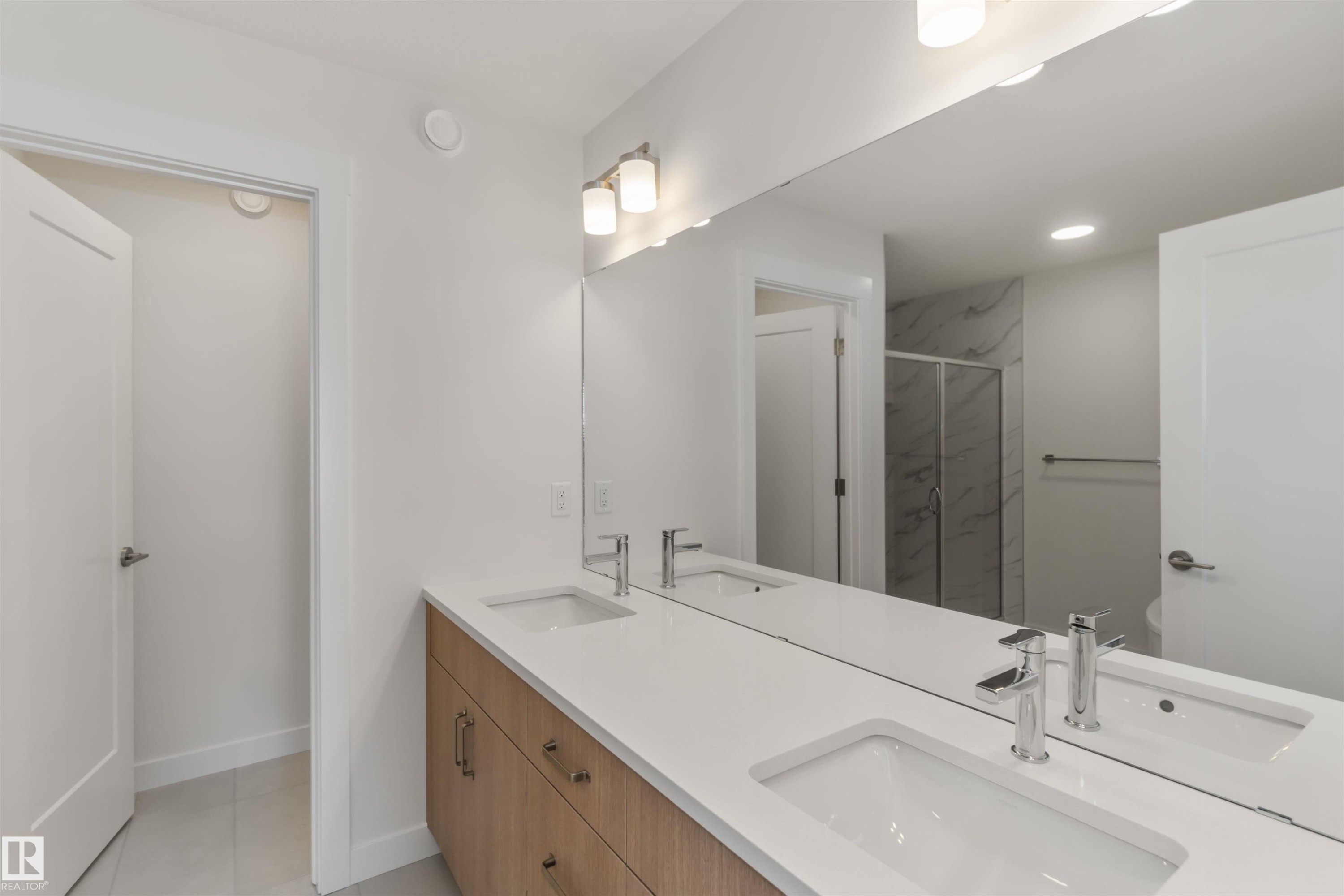 Full bathroom featuring a marble finish shower, double vanity, and recessed lighting - 2215 4 Avenue, Edmonton, AB - Indoor Photo Showing Bathroom
