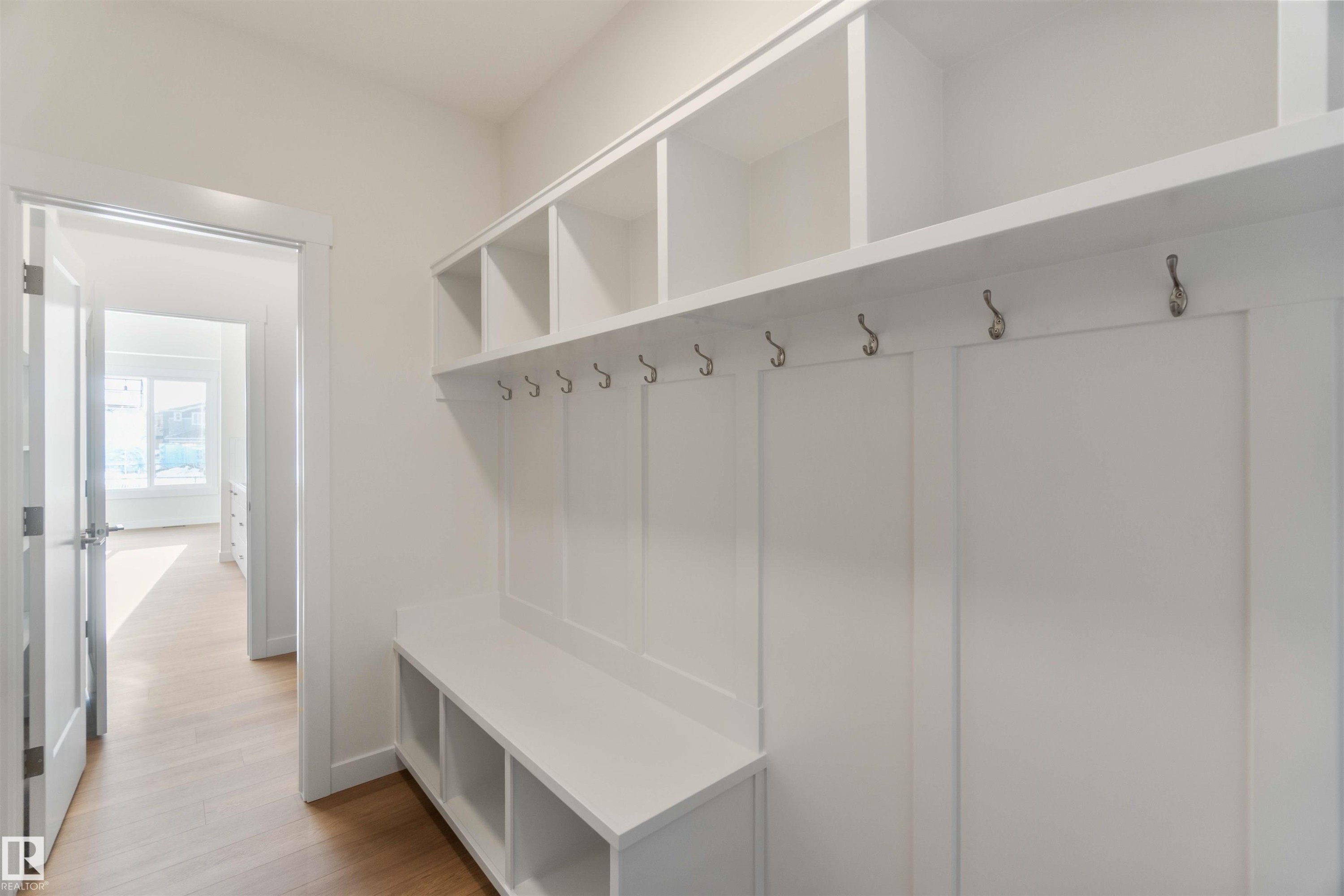 Mudroom with light wood-style flooring and baseboards - 2215 4 Avenue, Edmonton, AB - Indoor