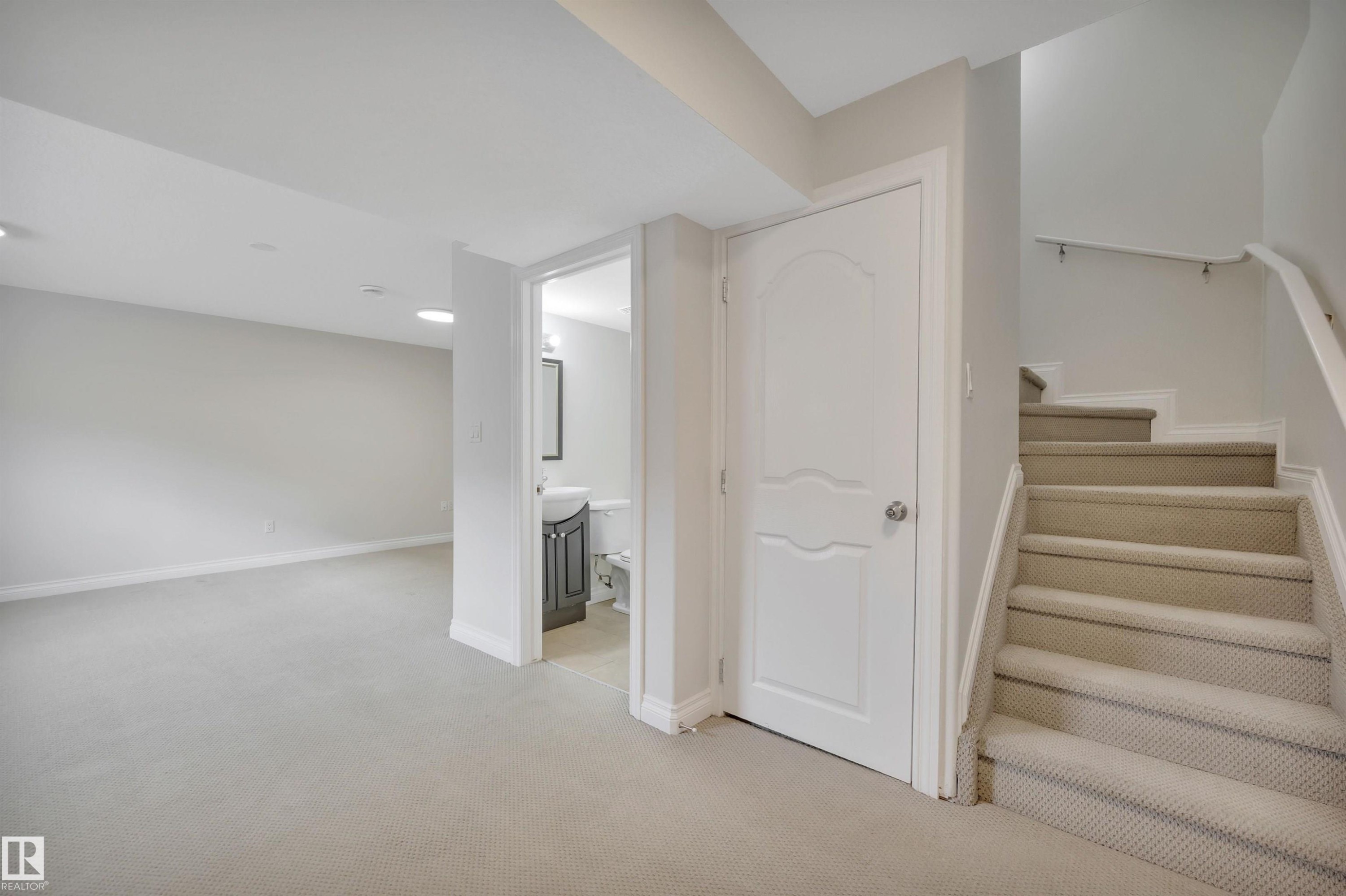 Staircase featuring carpet flooring - 457 Aster Close, Leduc, AB - Indoor Photo Showing Other Room