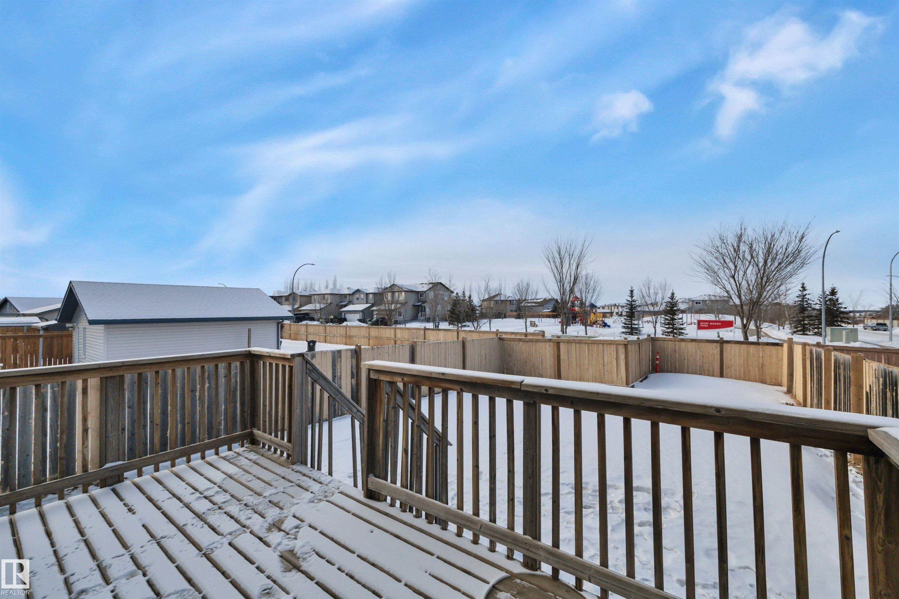 Wooden terrace featuring a fenced backyard and a residential view - 457 Aster Close, Leduc, AB - Outdoor With Deck Patio Veranda